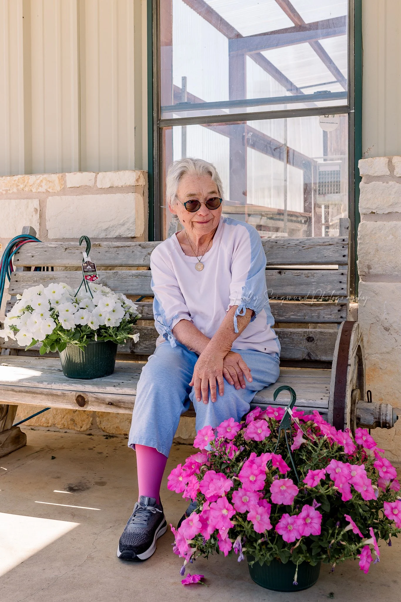 lifestyle branding images featuring a greenhouse and flowers at Down Home Ranch in Elgin TX