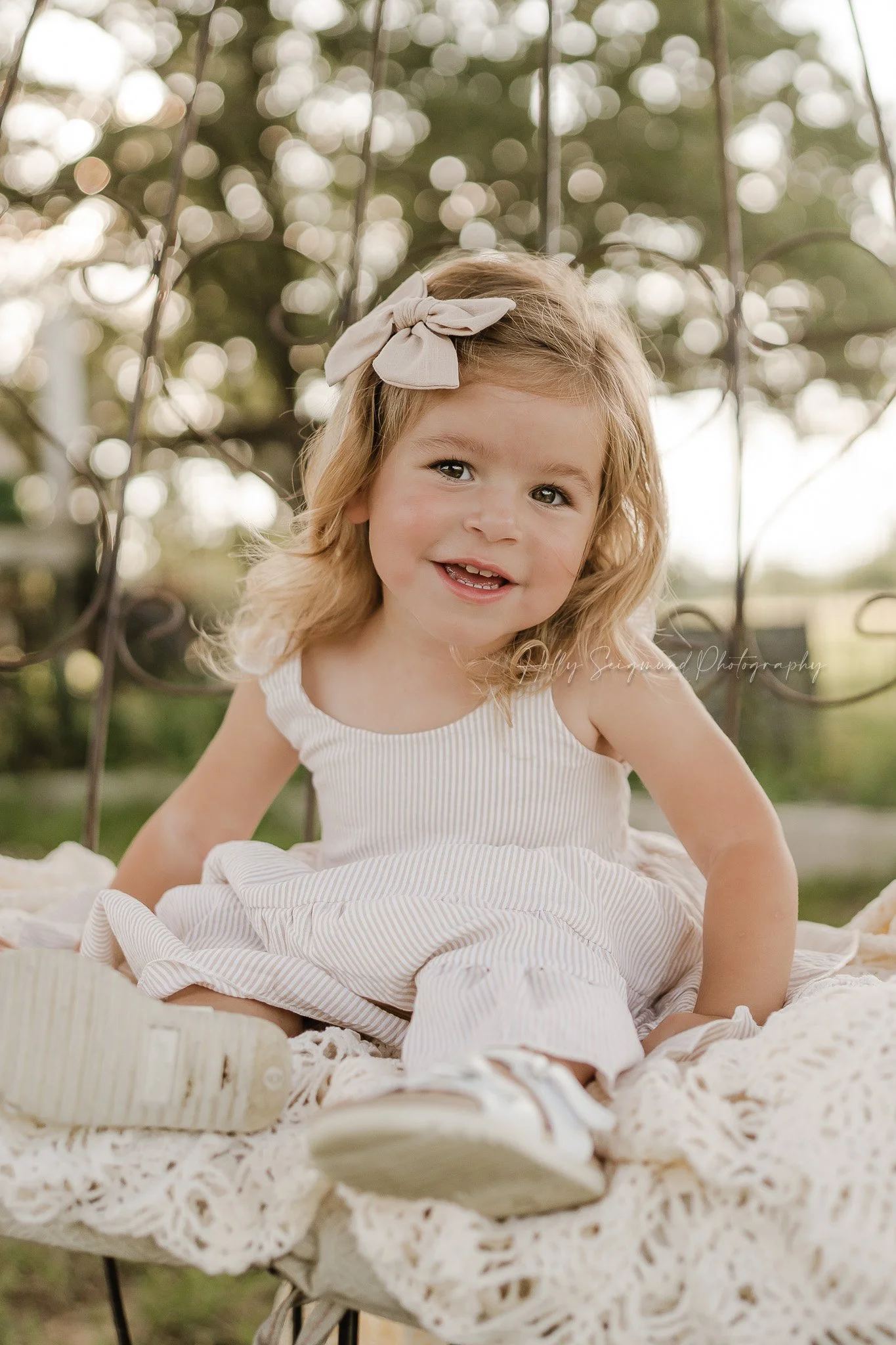soft light portrait of a little girl celebrating her 3rd birthday in a spring setting in Texas