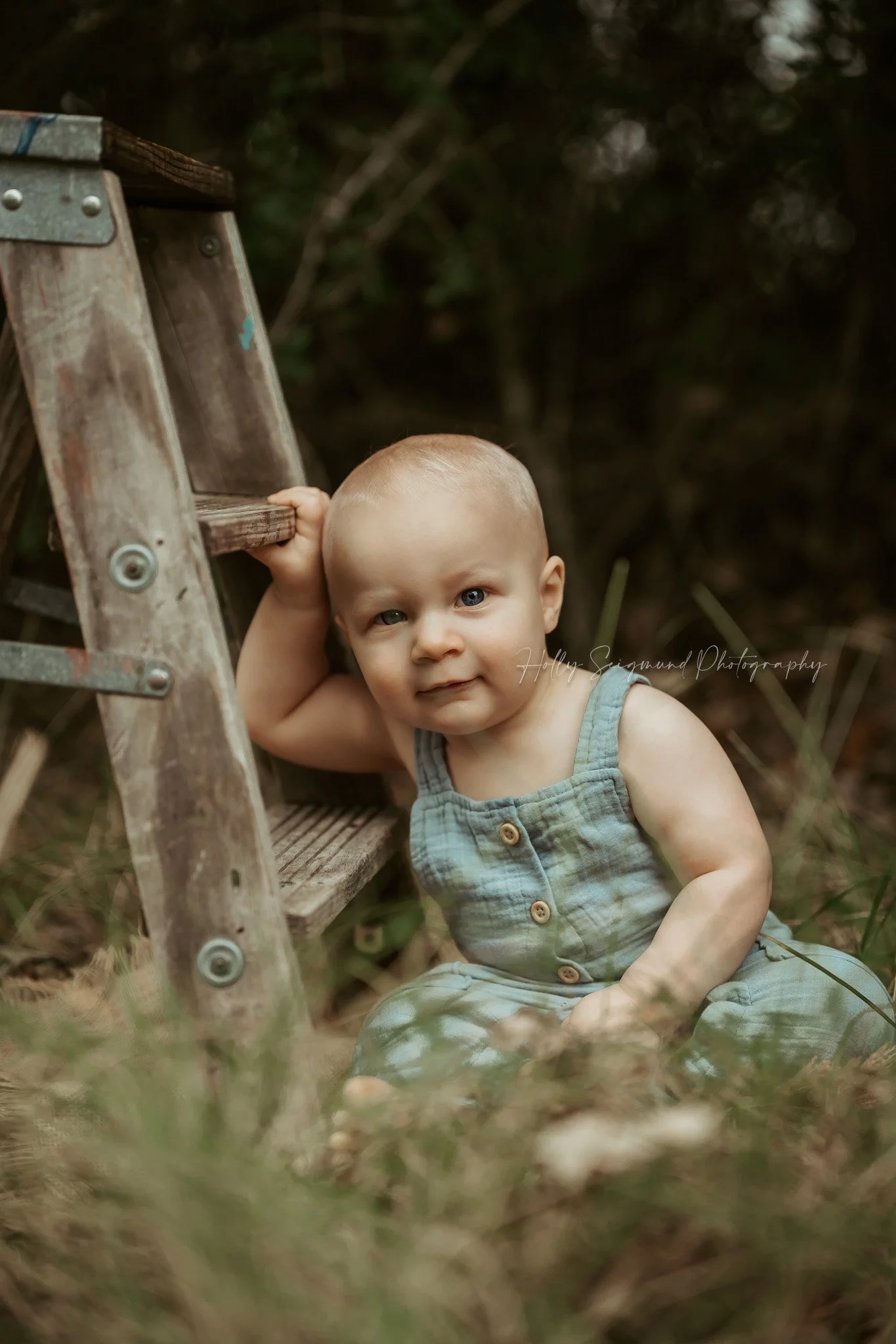 Baby boy's first birthday photos in the grass in Lee County Texas