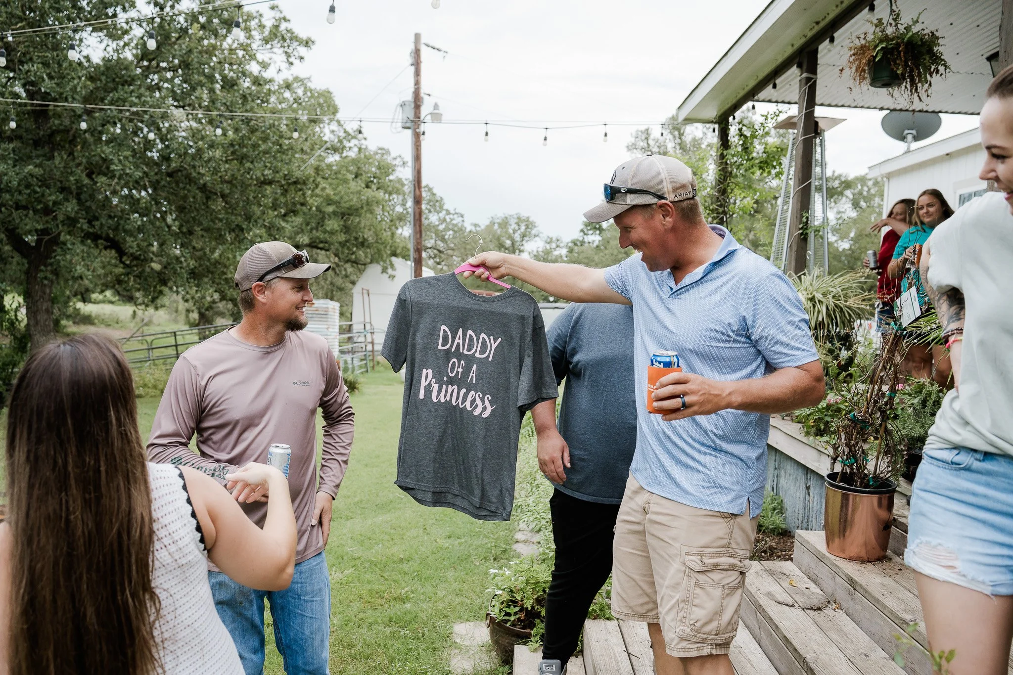 Gift opening moments at baby shower photographed in Central Texas