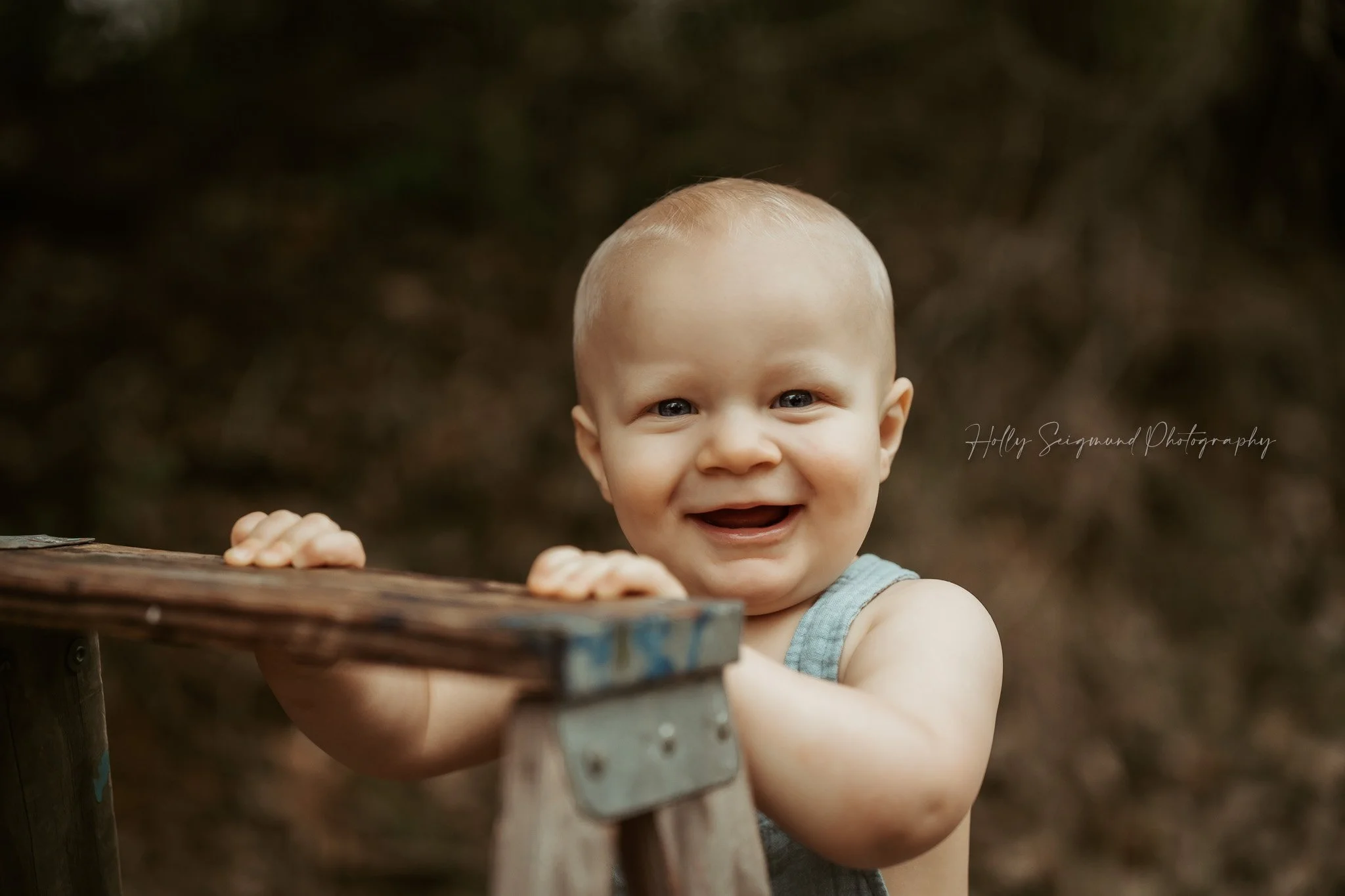 First birthday photo of baby boy in a simple outdoor session in Central Texas