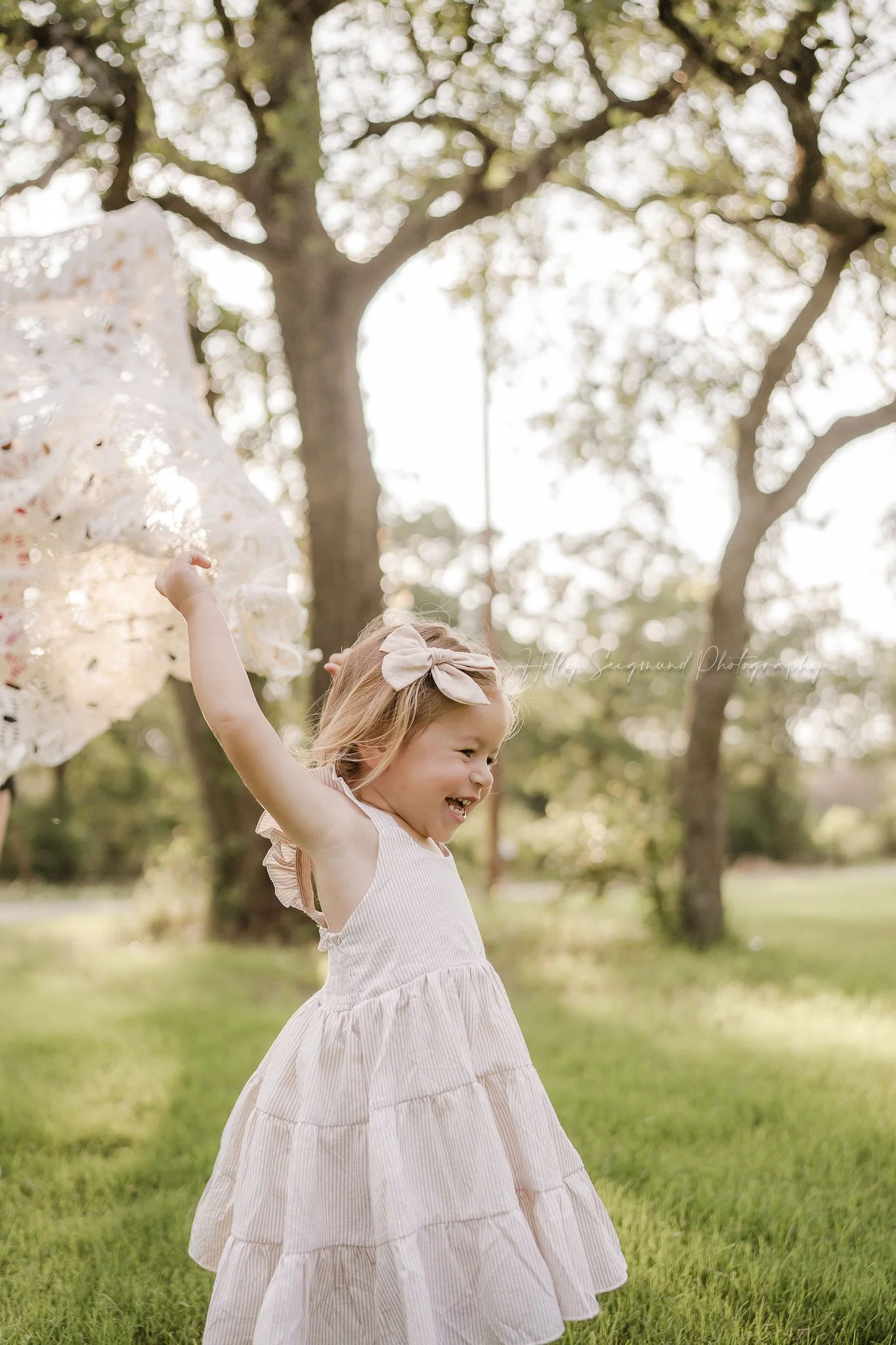 golden hour portrait of a 3-year-old girl during her spring birthday session in Central Texas