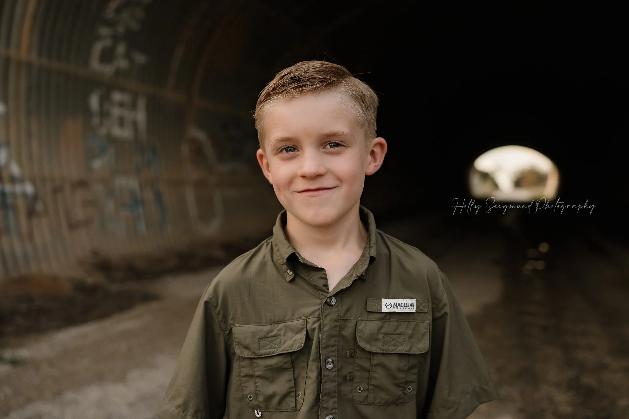 young boy posing during his 7th birthday session in Lee County Texas