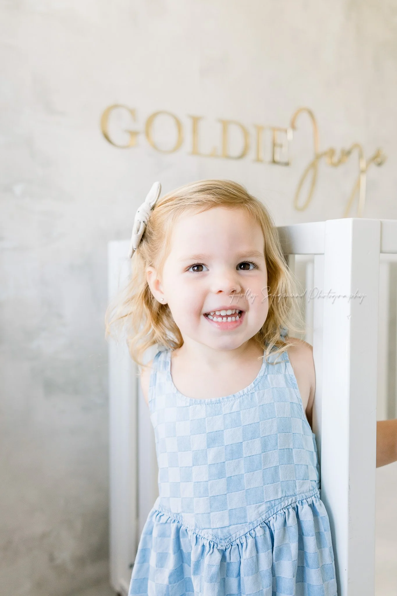 Sister during an in-home newborn session in Central Texas