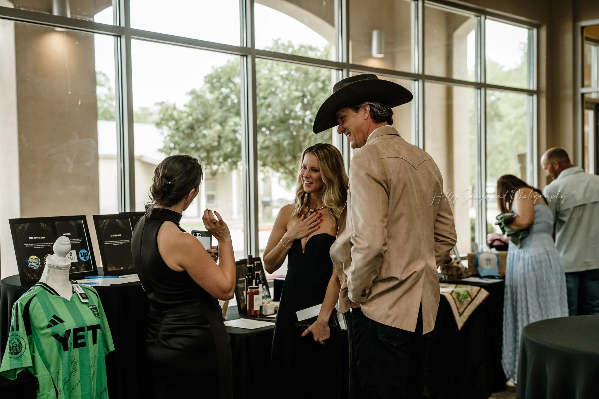 Guests networking at Down Home Ranch gala in Bastrop Texas