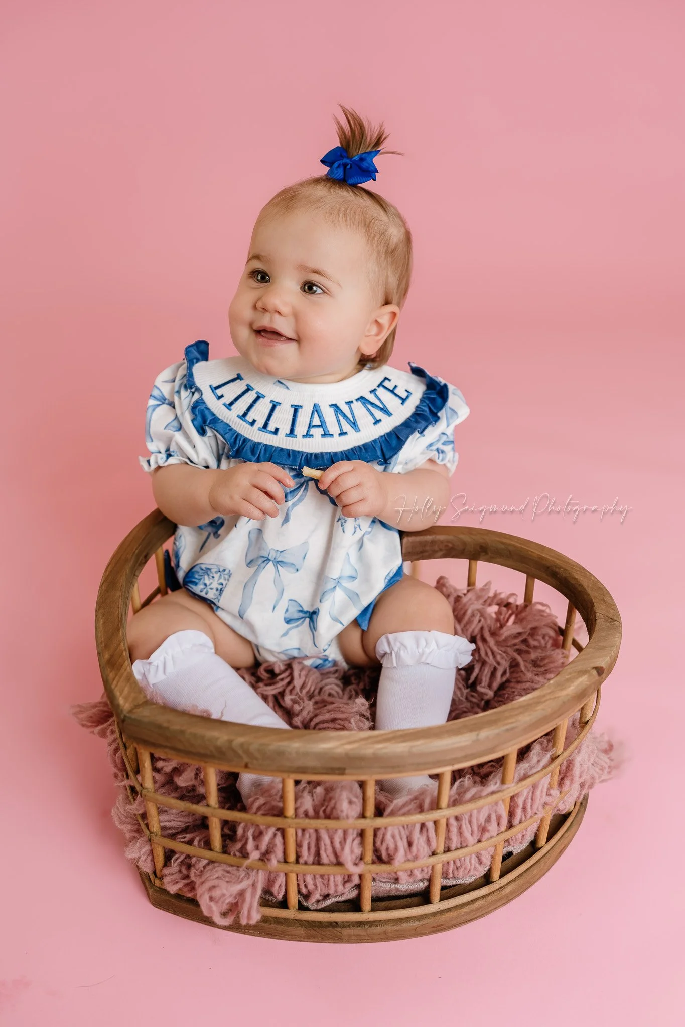 Simple pink paper with flash photography for girls first birthday photos in a studio in Lee County Texas