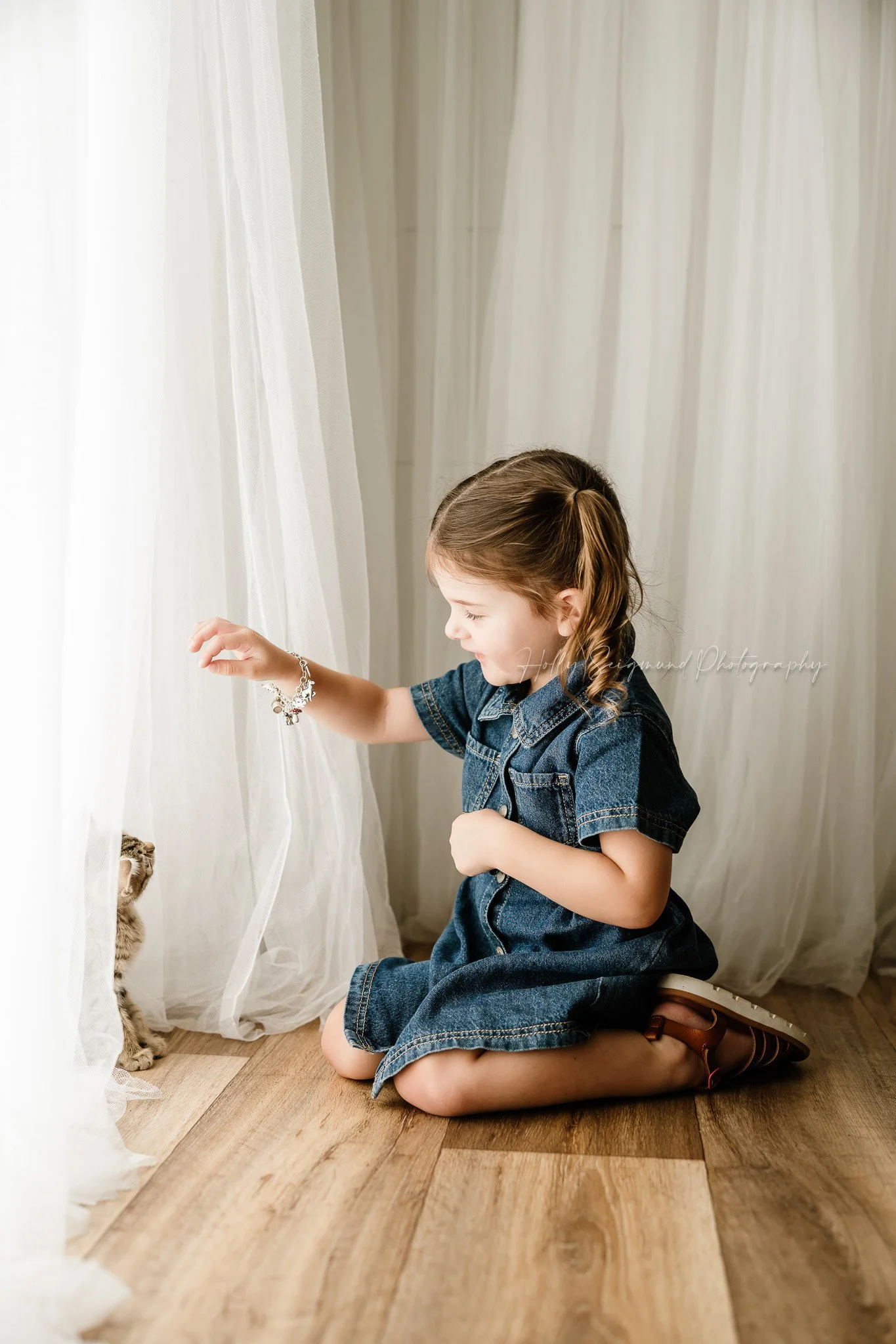 2-year-old girl celebrating her birthday in a natural light studio in Lexington Texas