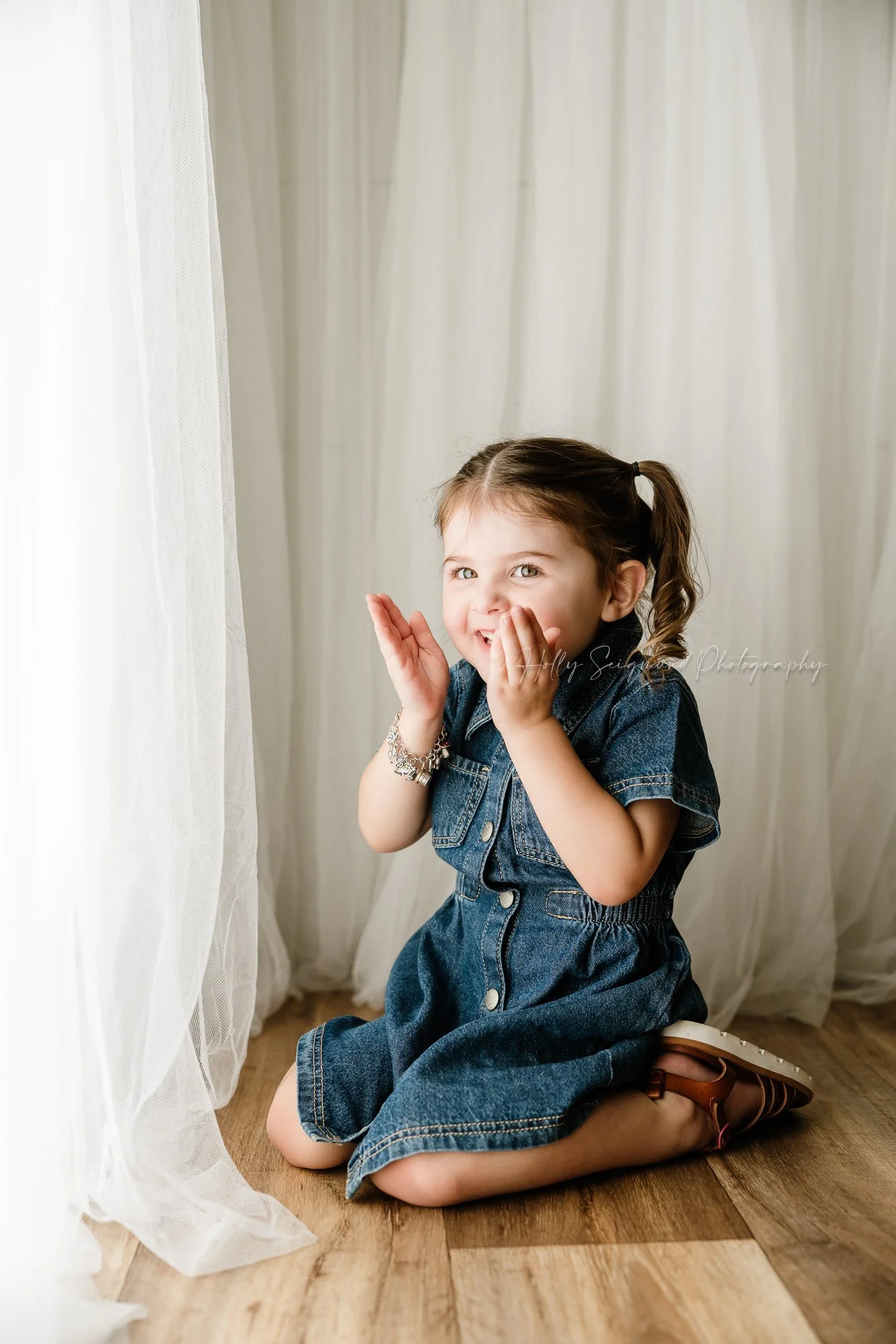 toddler girl posing in a natural light studio for her 2nd birthday in Lexington Texas