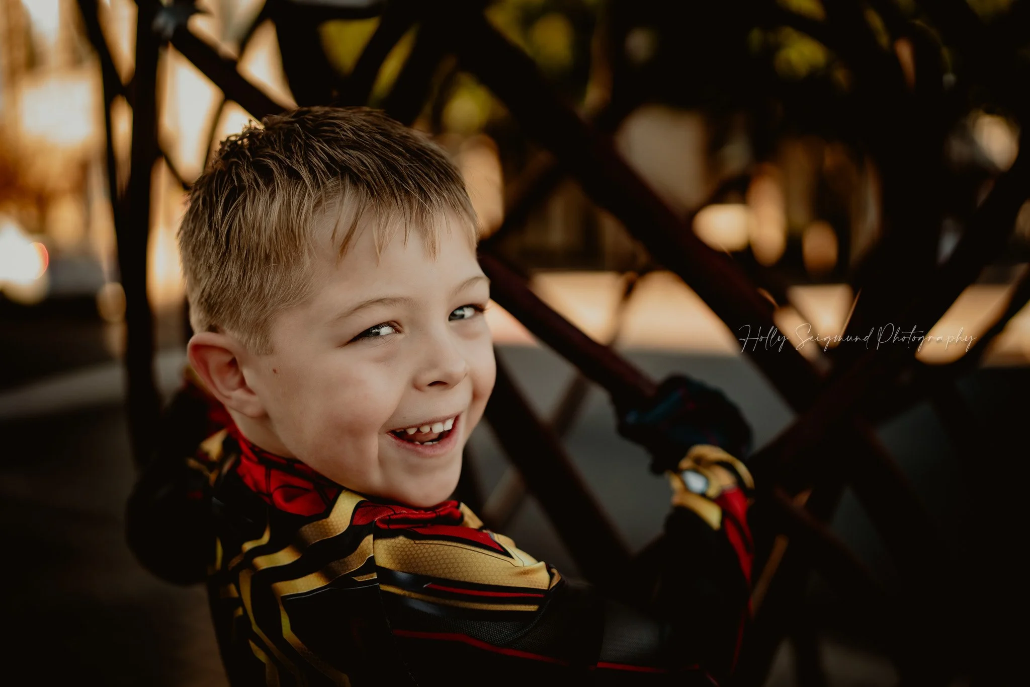 6-year-old boy dressed as Spiderman posing outdoors for a birthday photoshoot in Georgetown, Texas