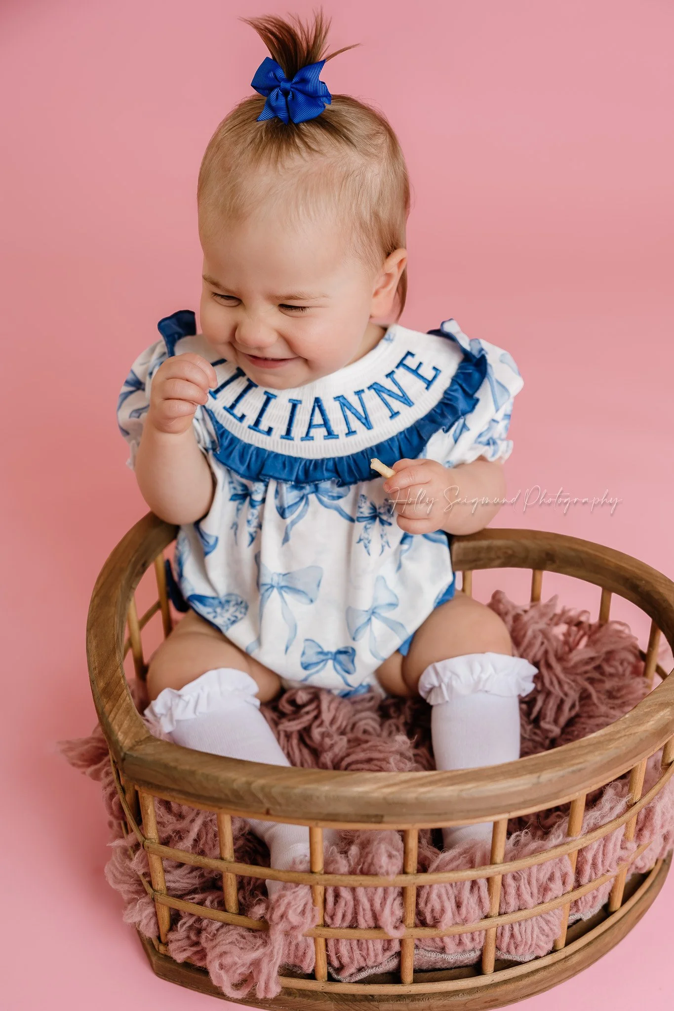 Simple pink paper with flash photography for girls first birthday photos in a studio near Austin Texas