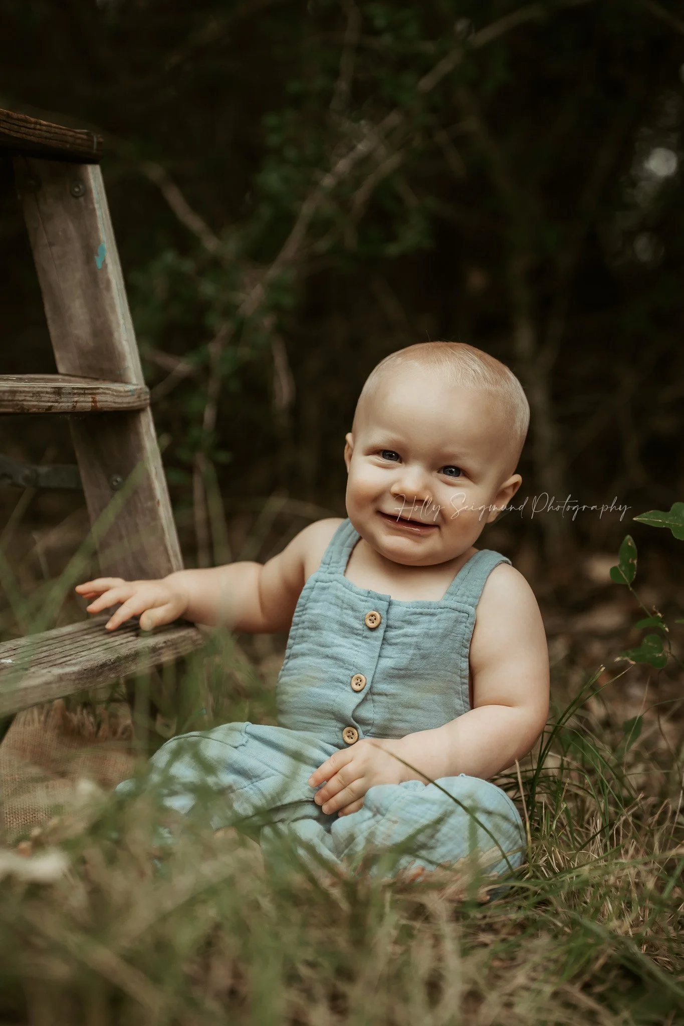 Baby boy first birthday photos outdoors in nature in Central Texas