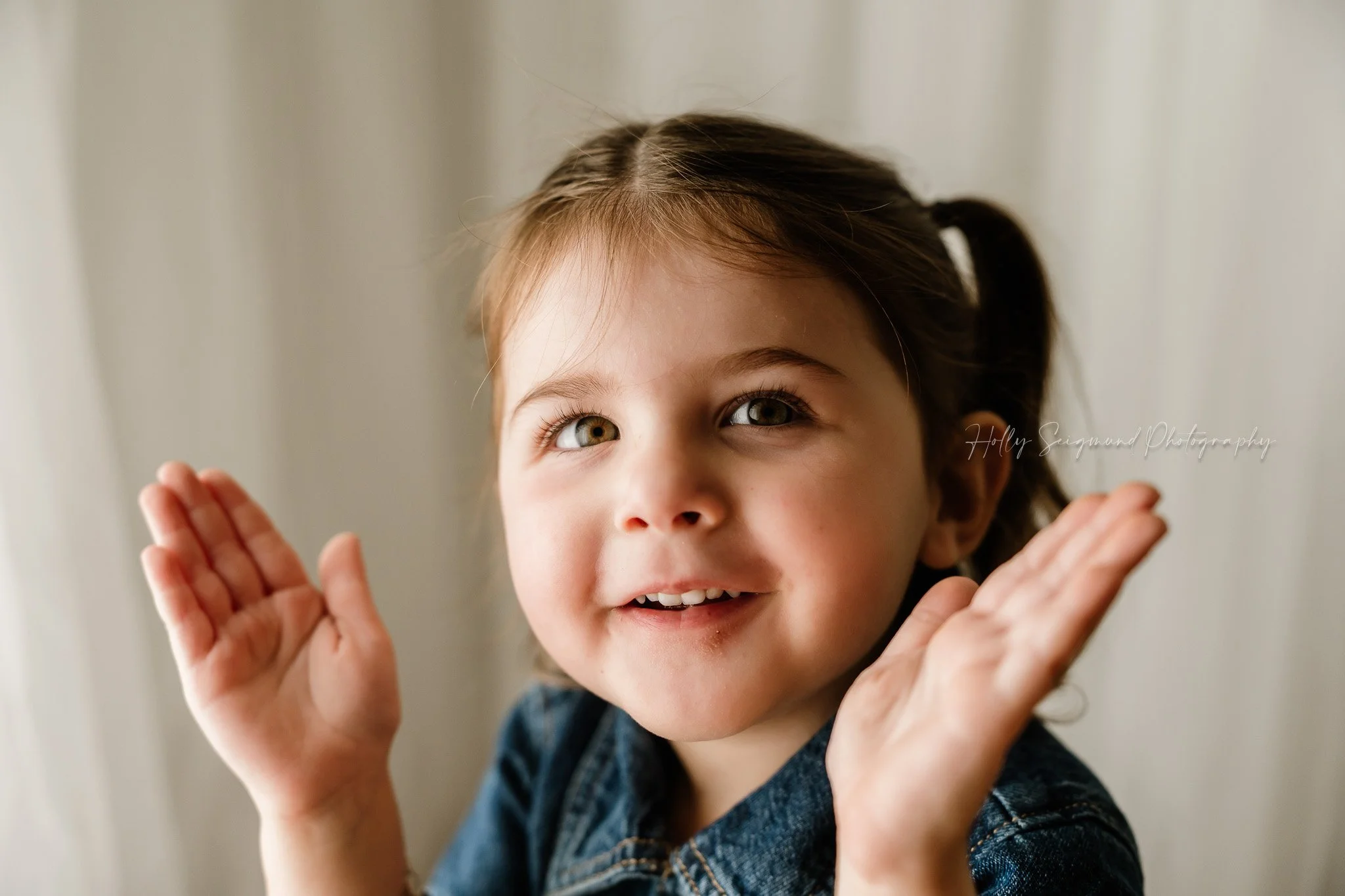 birthday photoshoot of a 2-year-old girl in a natural light studio in Lexington TX