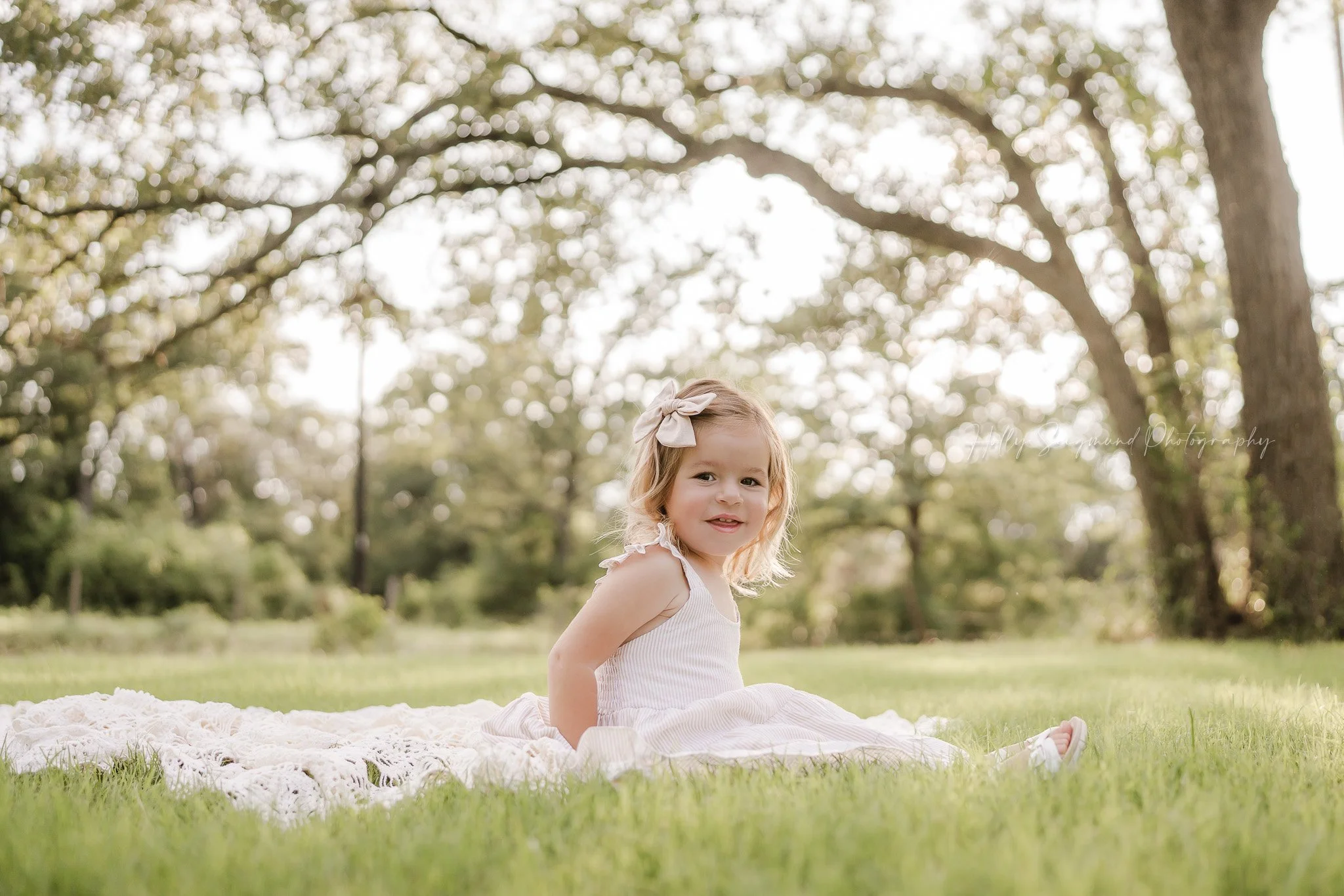 3-year-old girl celebrating her birthday during a spring photoshoot in Central Texas
