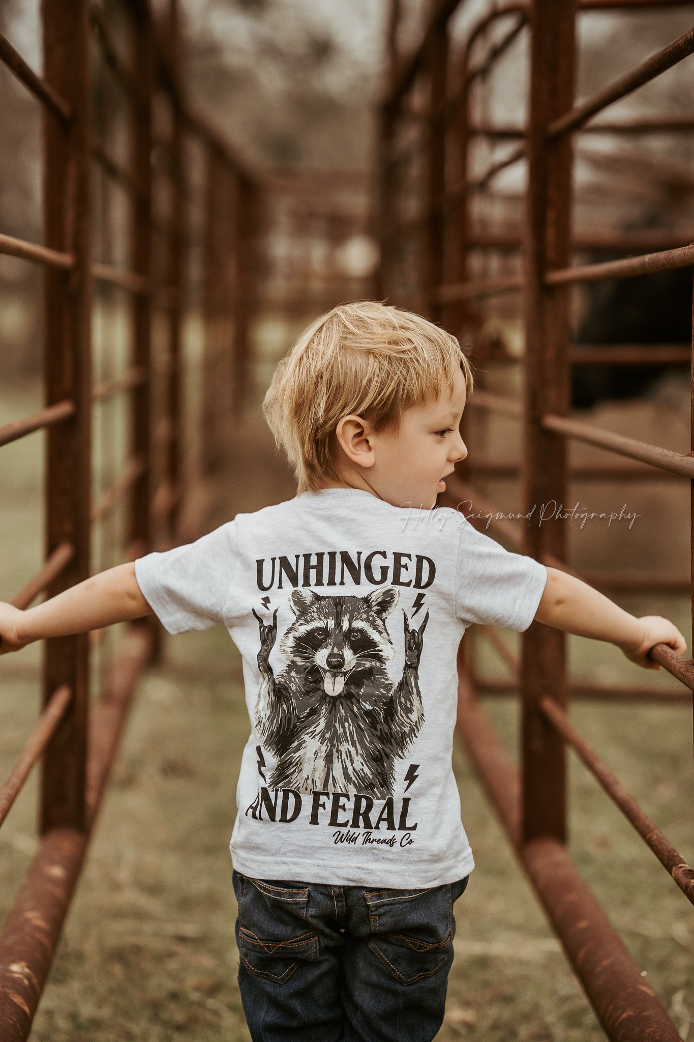 outdoor birthday portrait of a child in a country setting in Texas with warm sunset lighting
