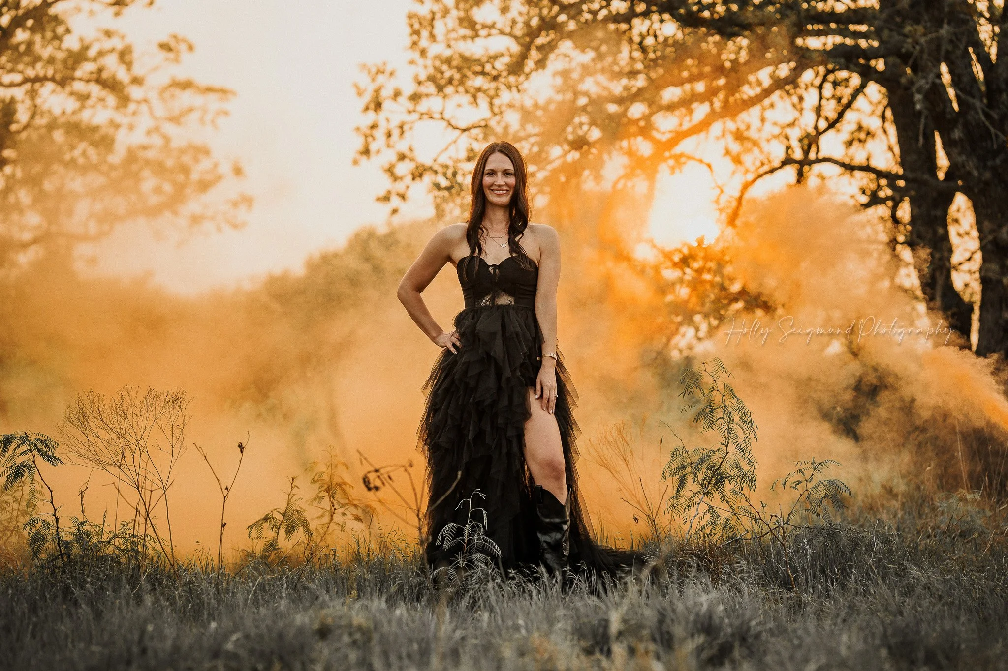 woman celebrating her 40th birthday with colored smoke during a photoshoot in Austin Texas
