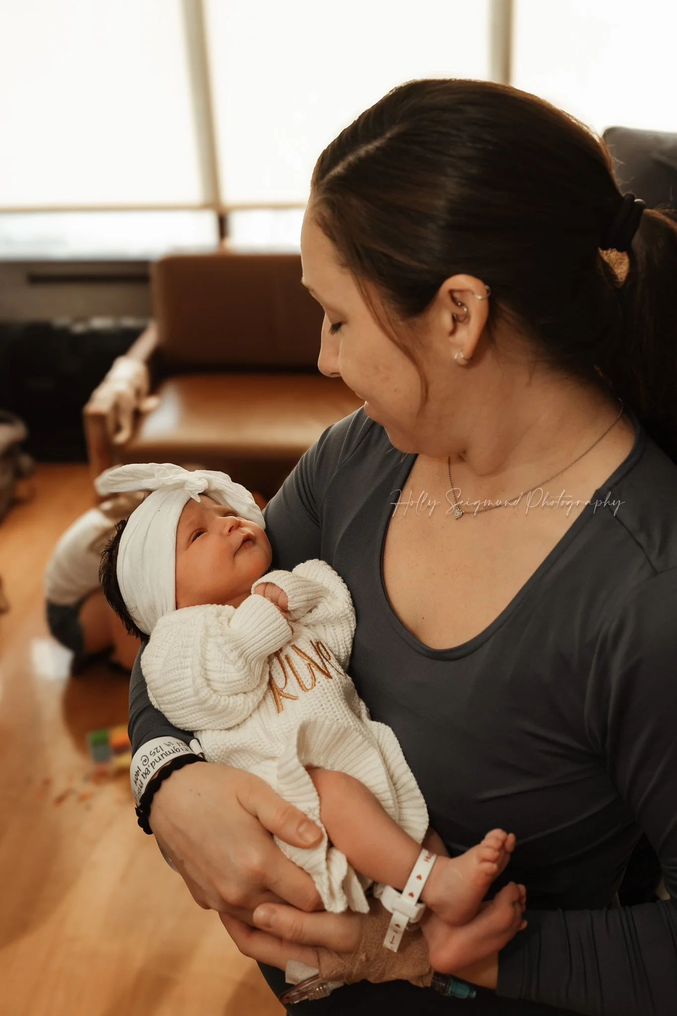 Mother holding her newborn at St. David’s Georgetown Hospital in Georgetown, Texas