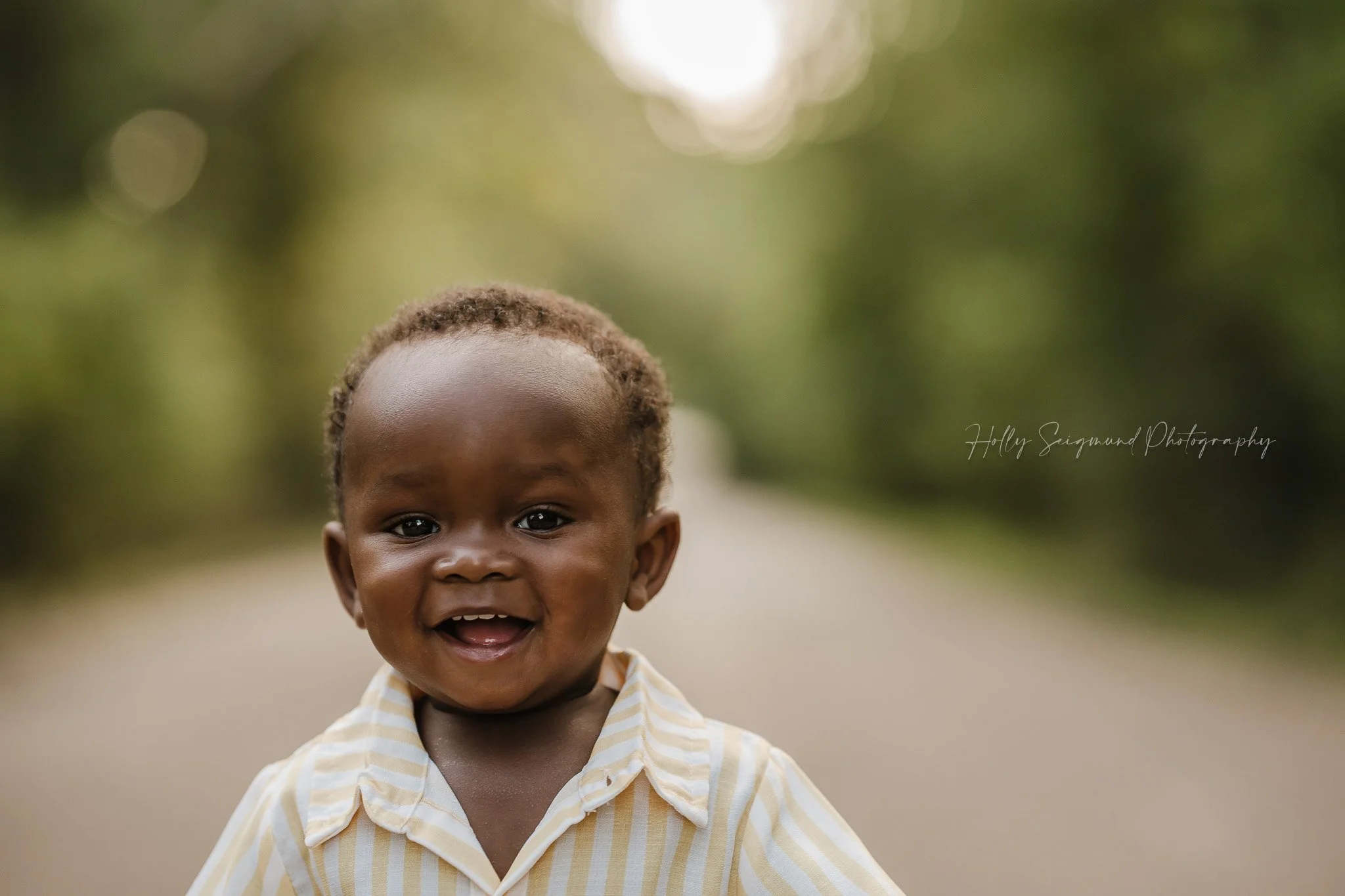 Boy's first birthday photo in a natural light outdoor space in Central Texas