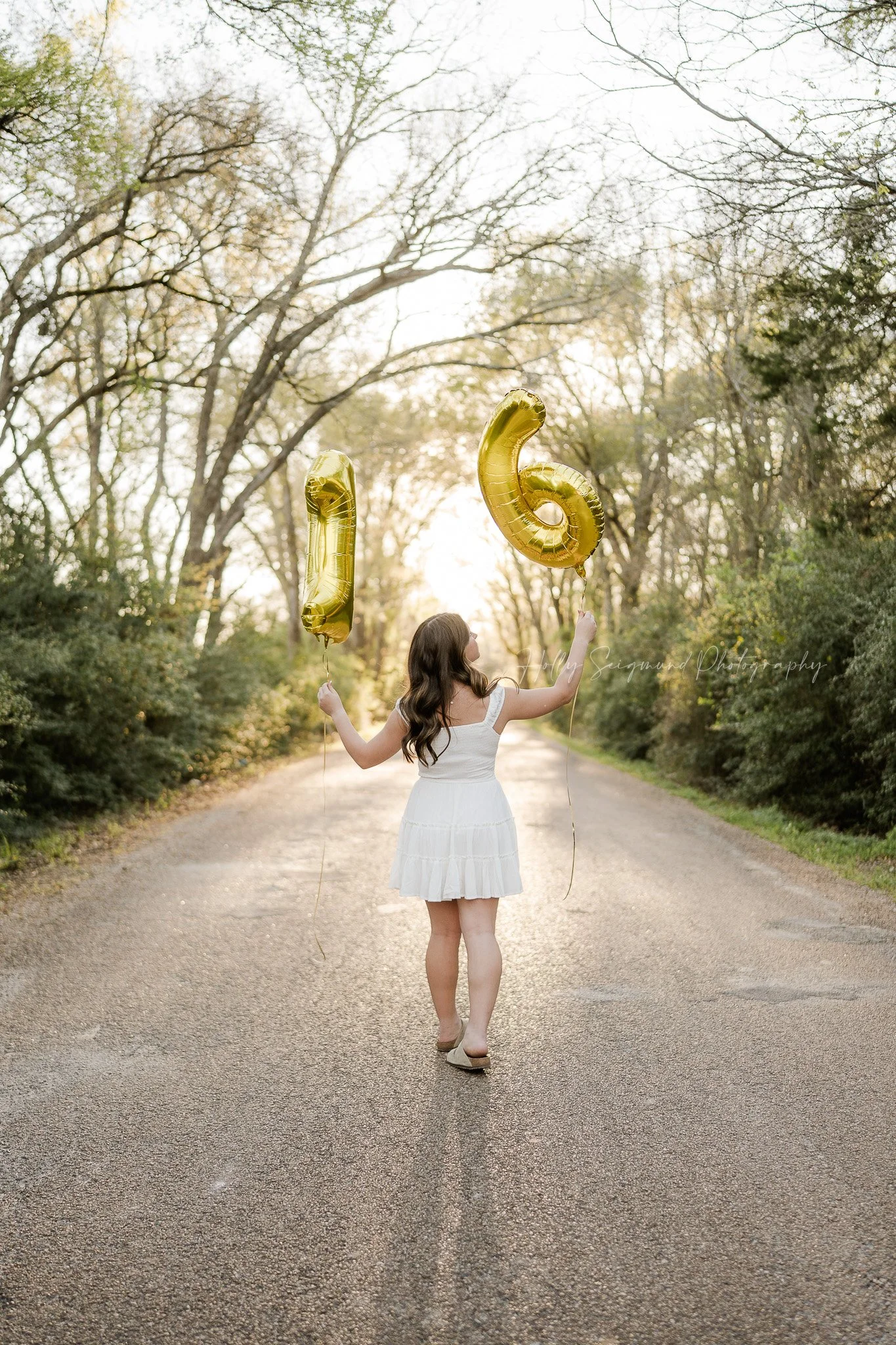 teenage girl celebrating her 16th birthday during an outdoor session in Lee County Texas