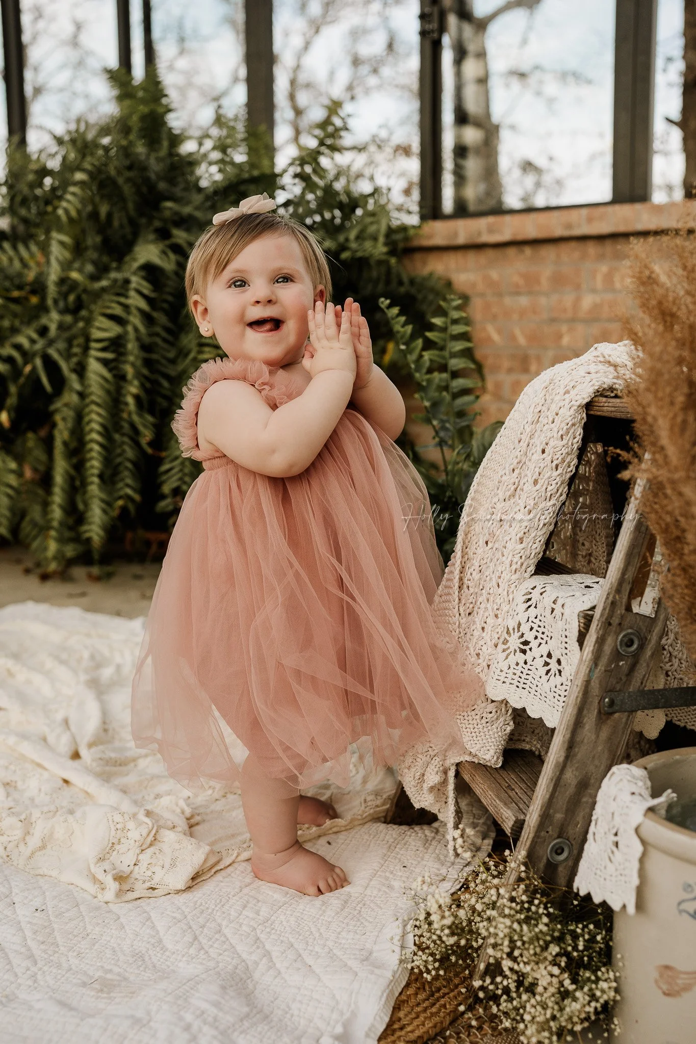 Boho girls 1st birthday photos in The Blue Conservatory with vintage crochet linens