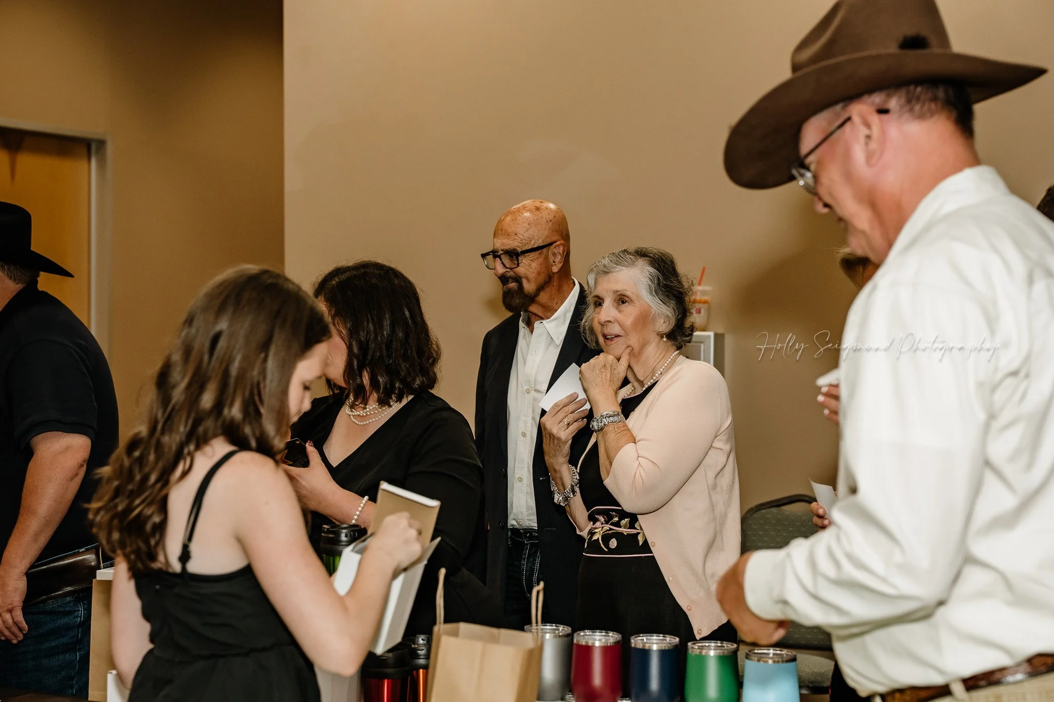 Central Texas event photographer capturing Down Home Ranch gala at Bastrop Convention Center