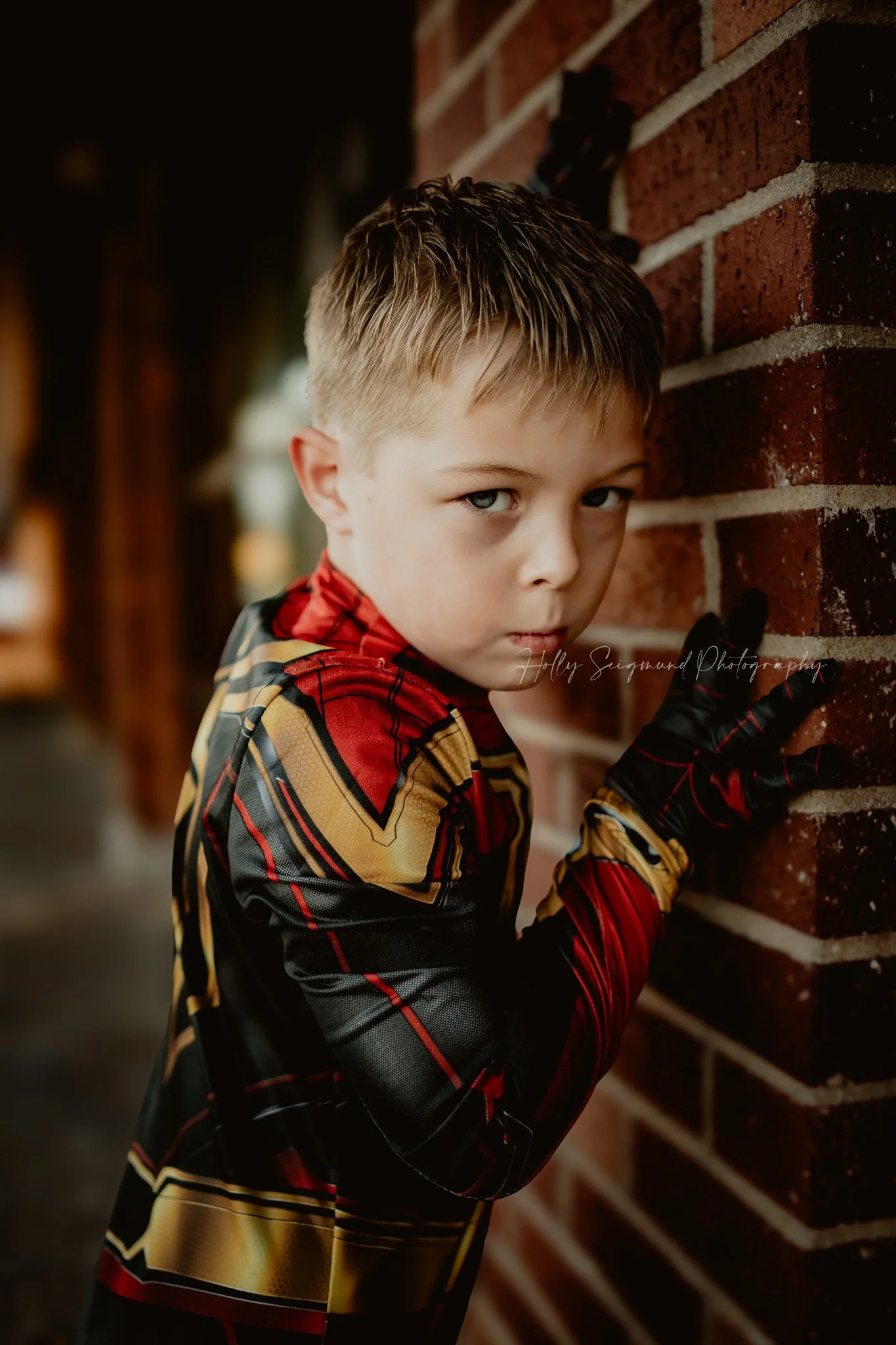 outdoor 6th birthday photoshoot with superhero theme featuring a child in Georgetown Texas