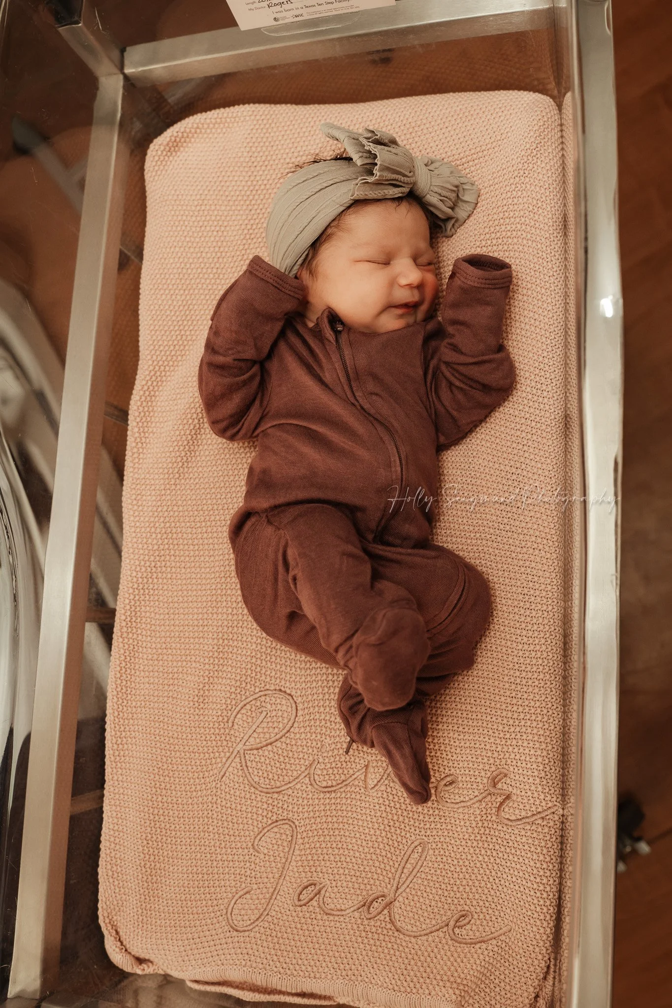 Newborn stretching on hospital bed at St. David’s Georgetown Hospital