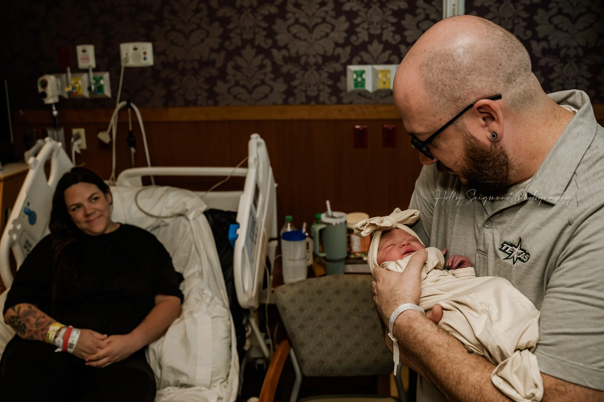Father meeting newborn baby at St. David’s Women’s Center of Texas in Austin, TX