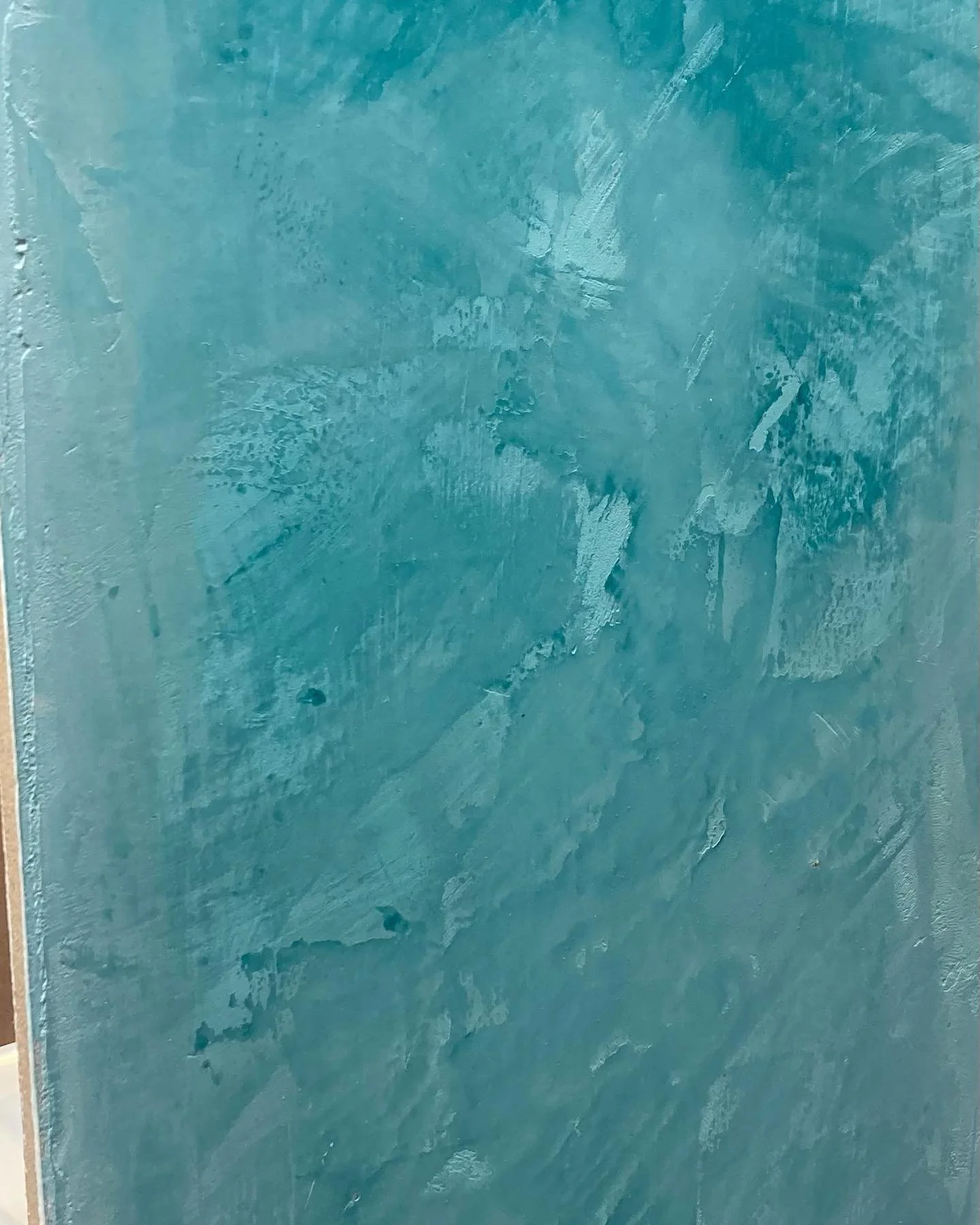 Polished teal Venetian plaster sample by CKS Drywall showing its marble-like depth and shine