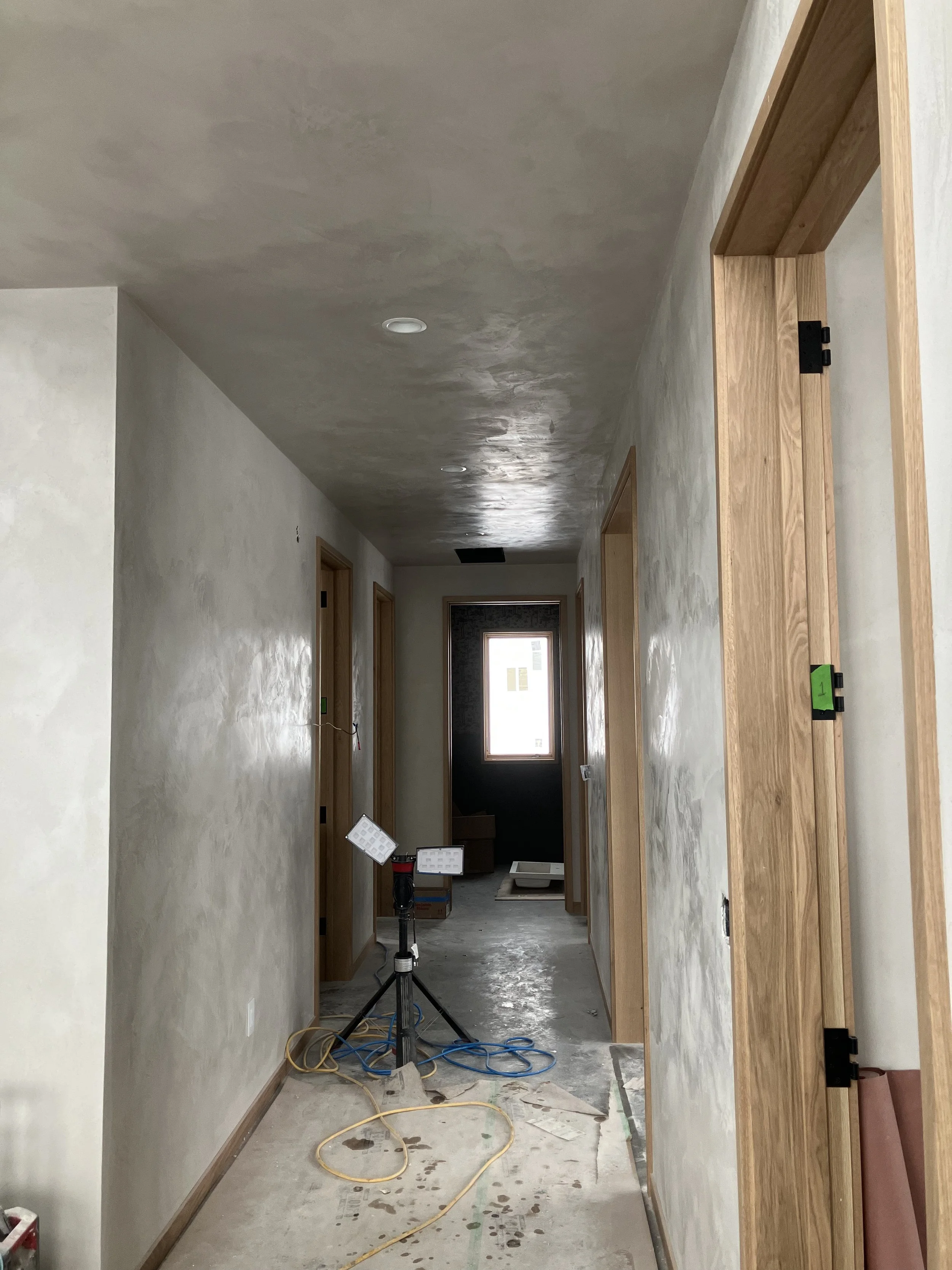 Long hallway with a soft lime plaster finish made with a New Age Artisans mix, Bozeman, MT