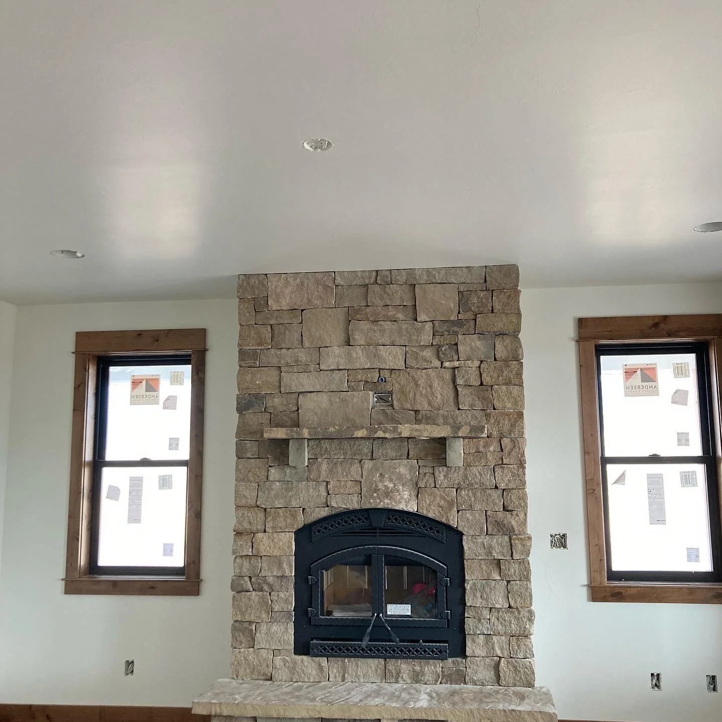 Finished drywall in a new Bozeman, MT home with a stone fireplace, by CKS Drywall