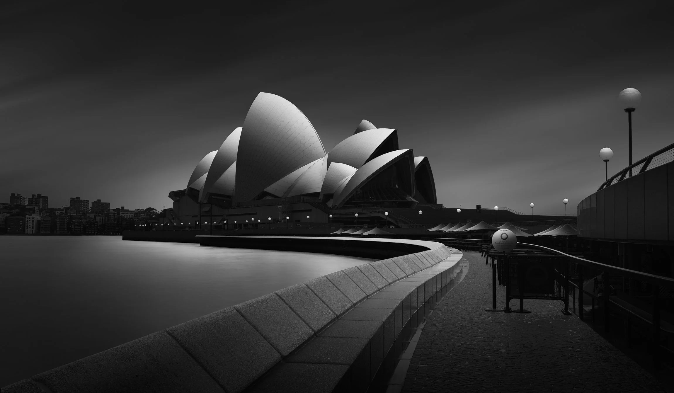 At the end of the waterfront promenade, beneath the iconic sails of the Sydney Opera House, the Opera Bar provides a perfect vantage point over the harbour. A long exposure transforms the water into a glass-like surface, smoothing away the movement a