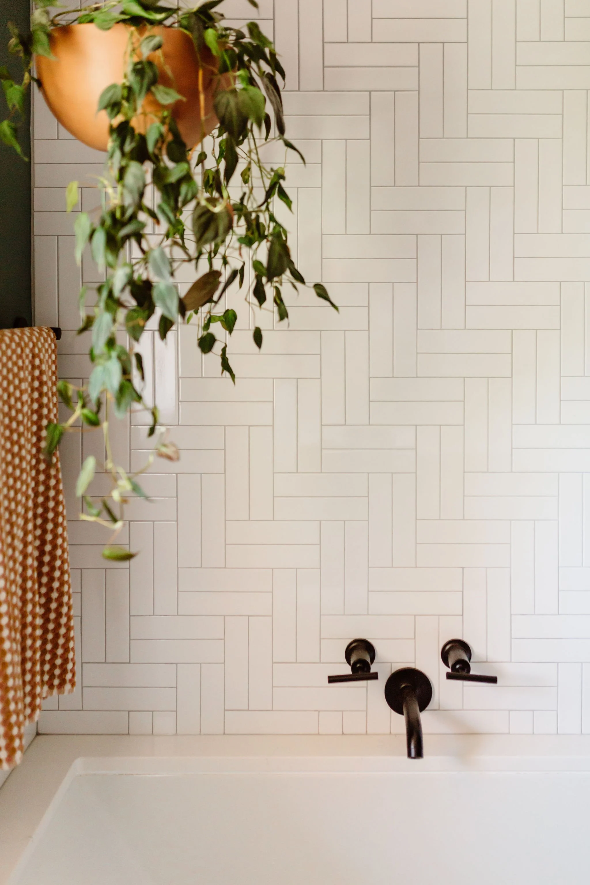 Close-up of intricate tile design in a contemporary bathroom.