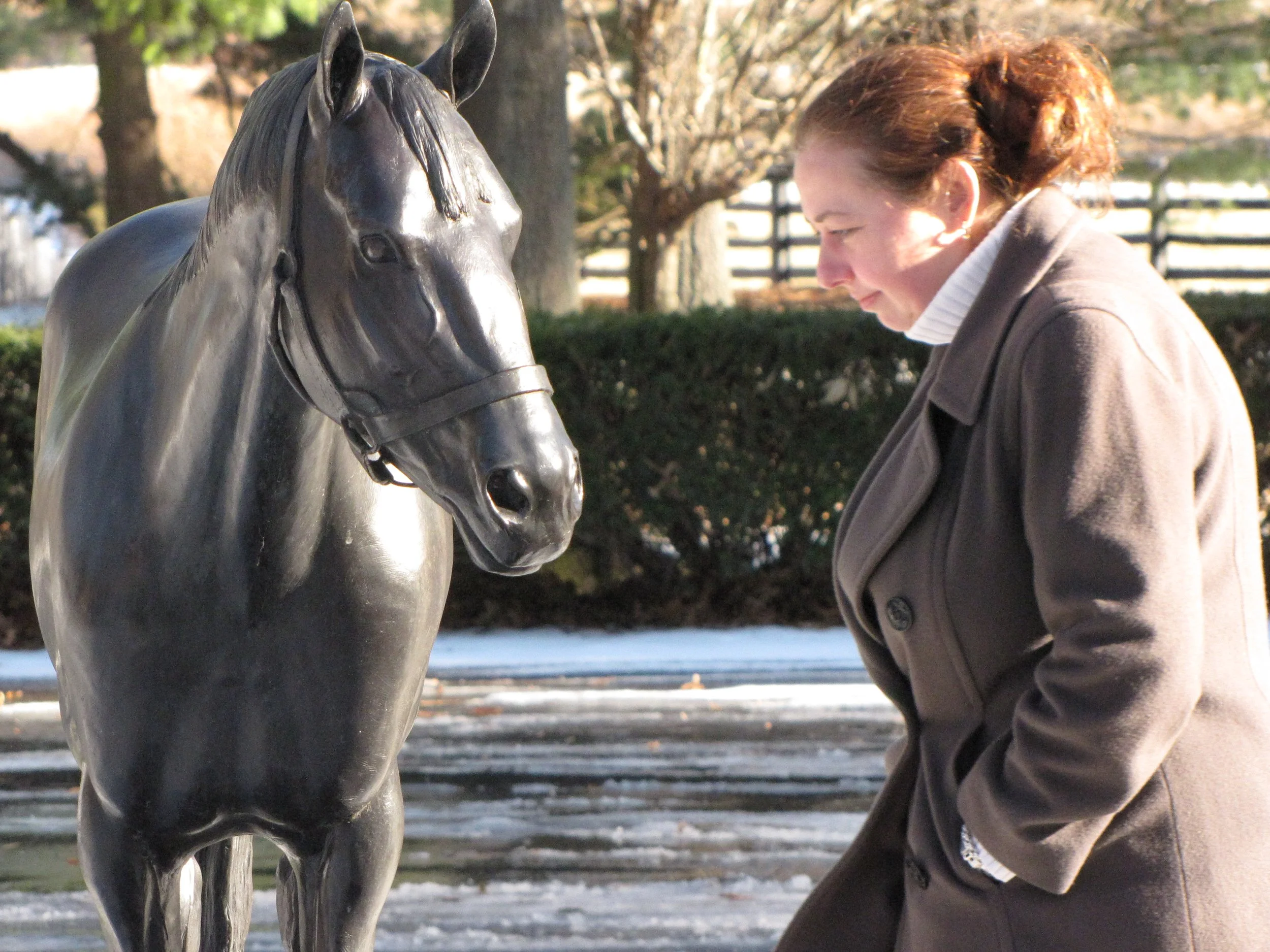 JANECKA WITH HORSE STATUE.JPG
