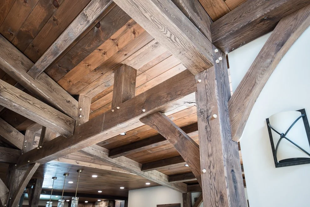 Interior shot showing a wooden ceiling and beams, part of a rustic or country-style home.
