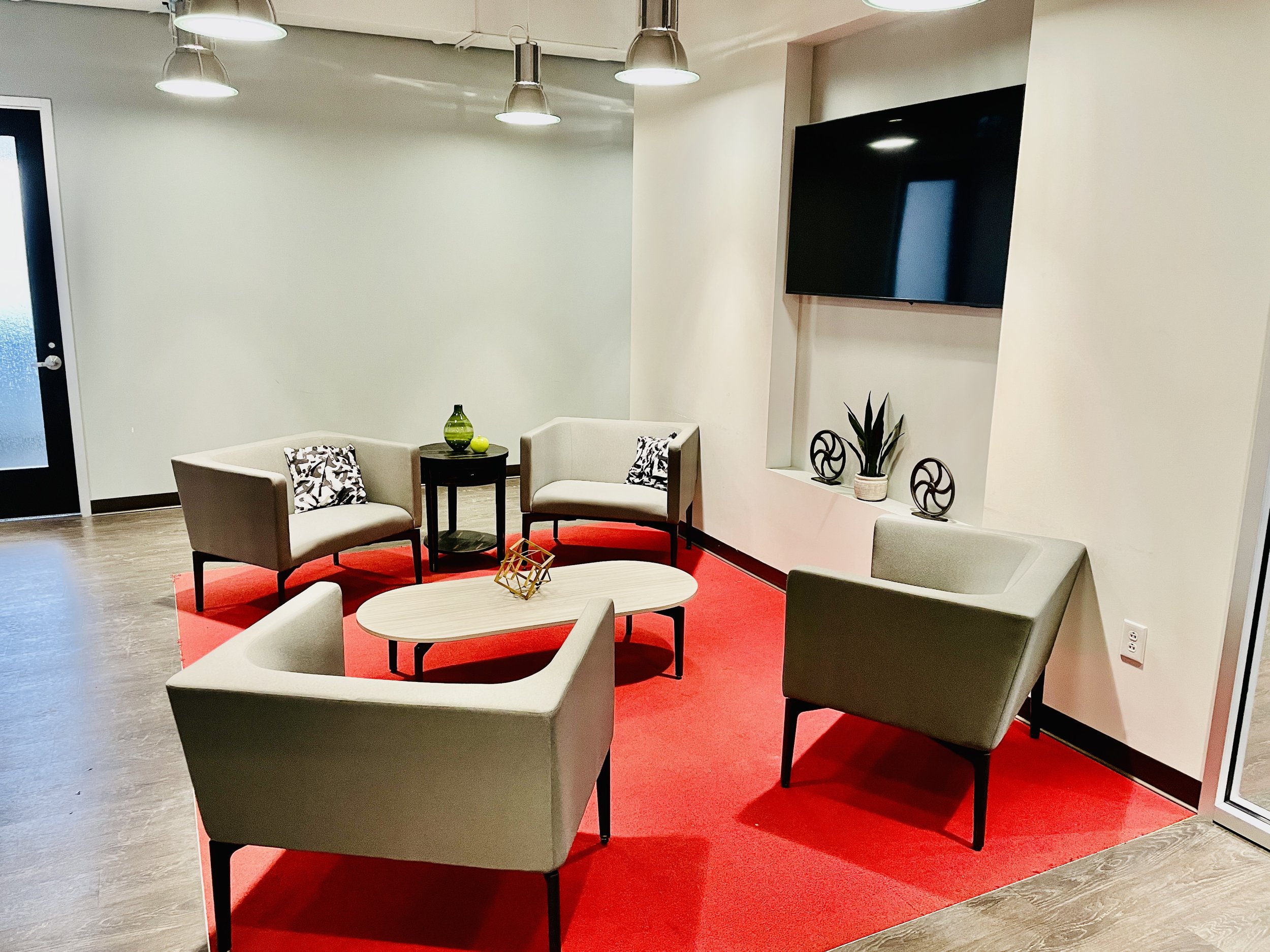 With cozy chairs, modern accents, and a bright, inviting layout, our waiting area offers a comfortable place to settle in before your session.