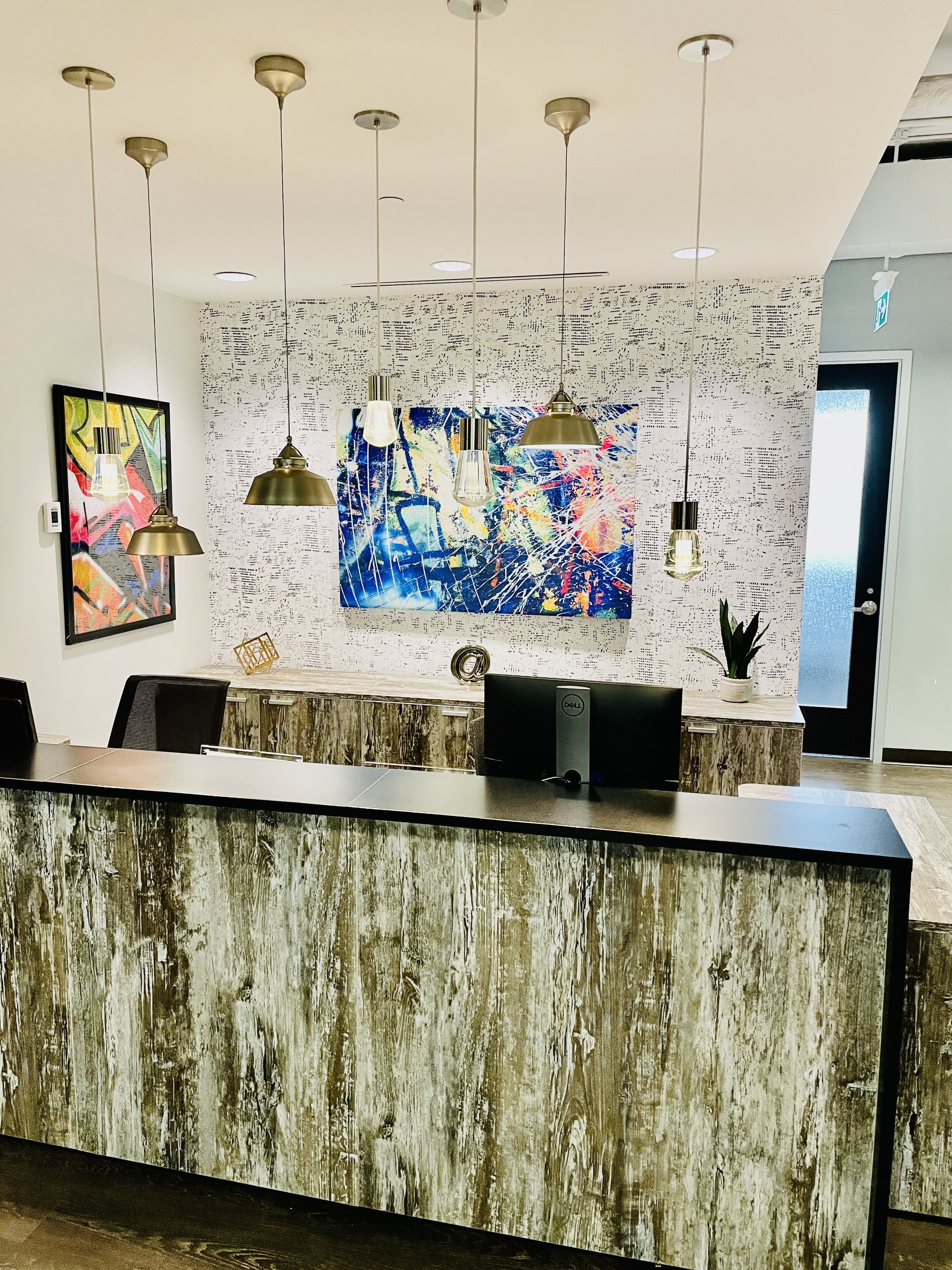 Our reception area offers a warm, modern atmosphere designed to help you feel comfortable from the moment you arrive.