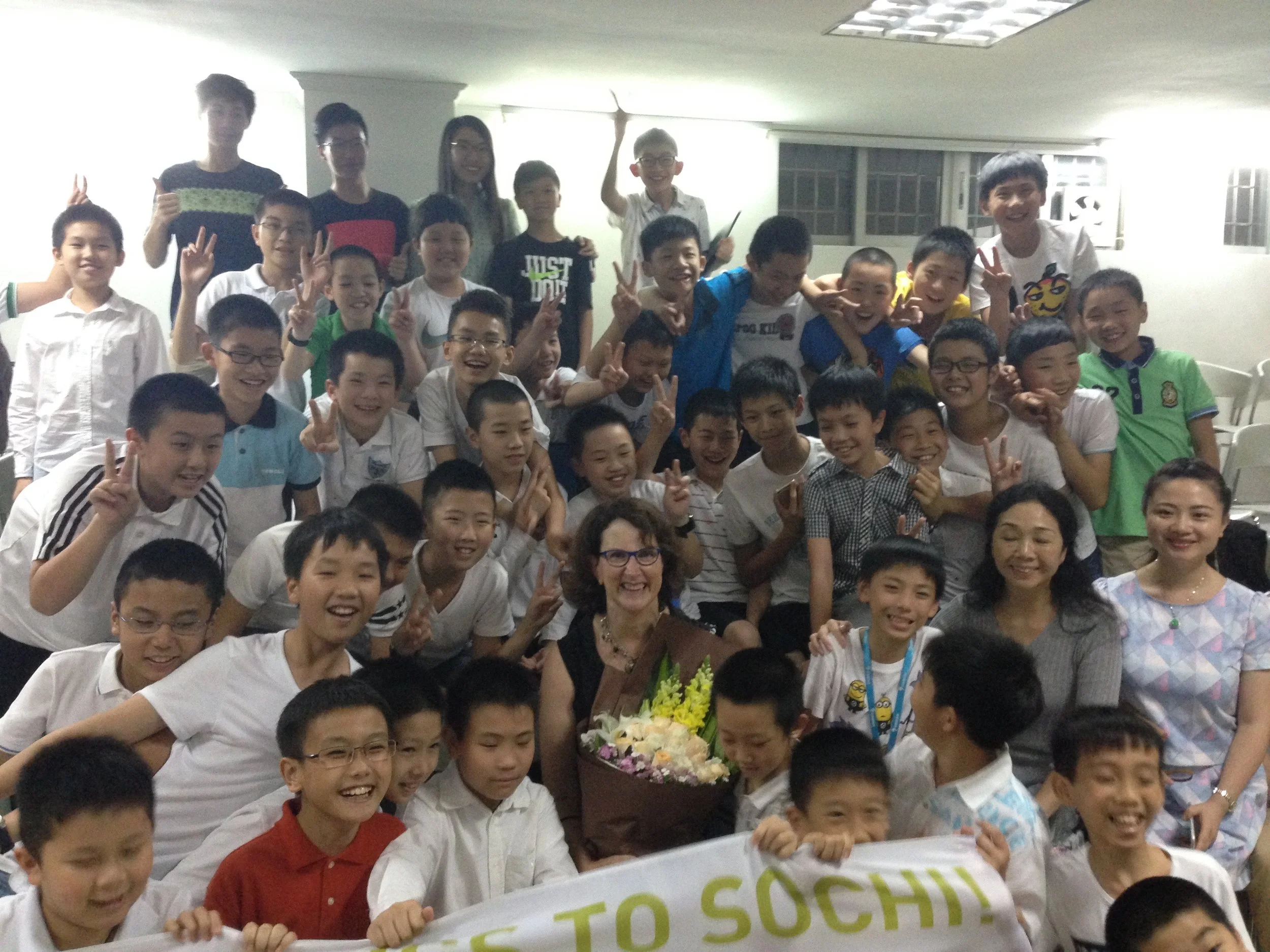 Angela with boys choir in China