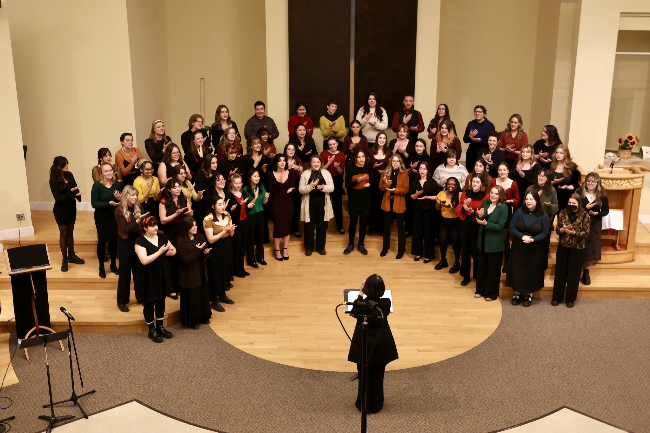 Angela conducting a choir