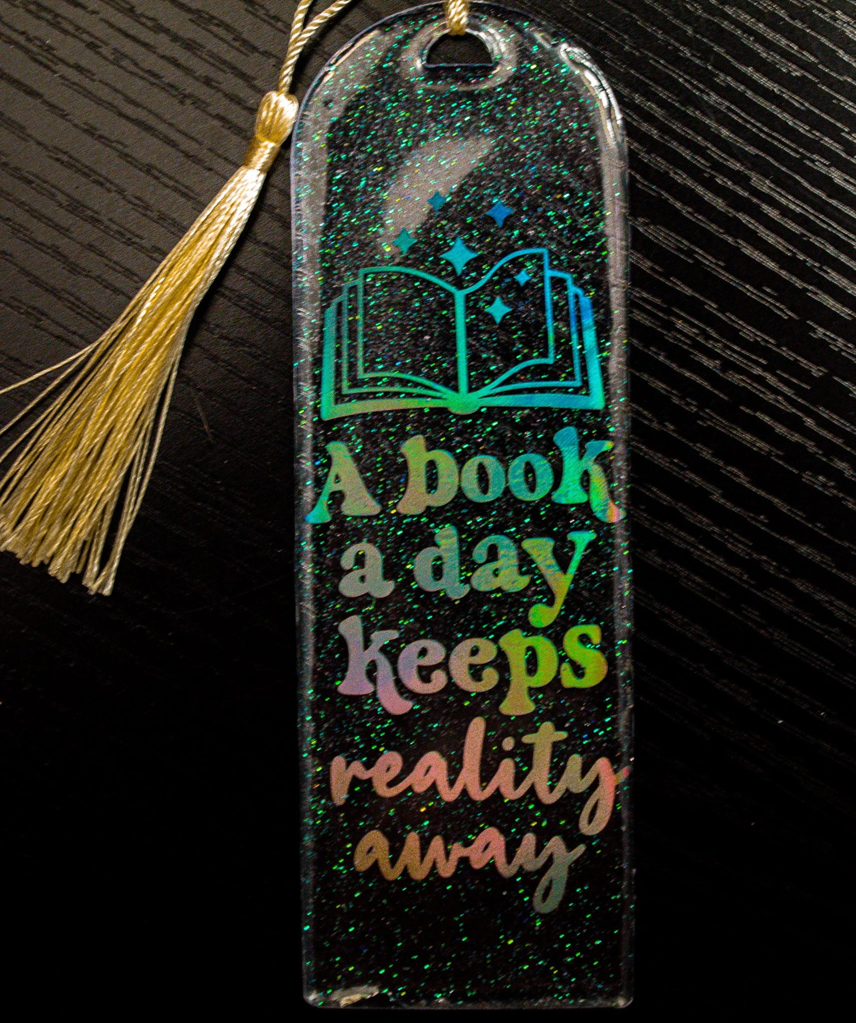 A Book a Day Keeps Reality Away Resin Bookmark