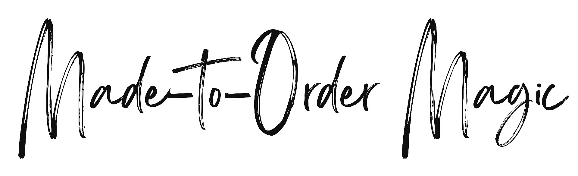 Neon sign with the text 'Made to Order Magic' in cursive font, illuminated in white against a black background.