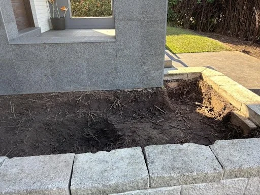 During works — cleared clay beds, team on site