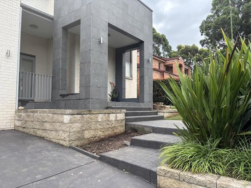 Original strelitzia and gymea lily in the raised entry beds