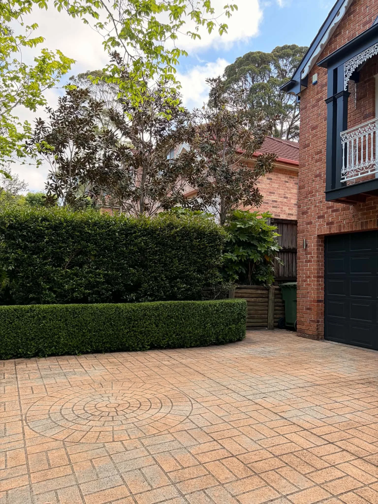 driveway-brick-house-clipped-hedge.jpg