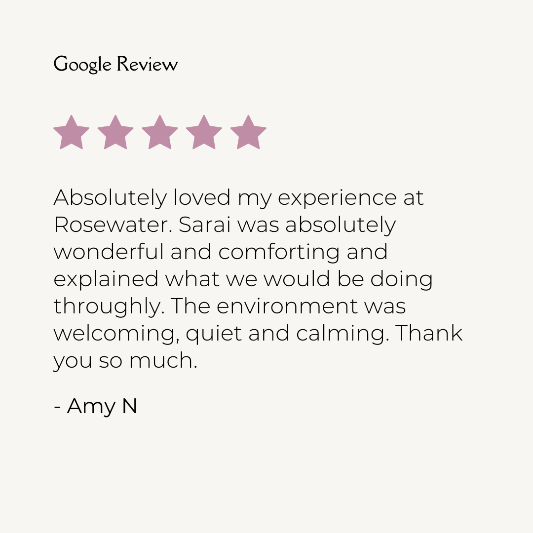 Google review with five purple stars and a positive testimonial from Amy N about her experience at Rosewater, praising Sarai for being wonderful, comforting, and thorough, and describing the environment as welcoming, quiet, and calming.