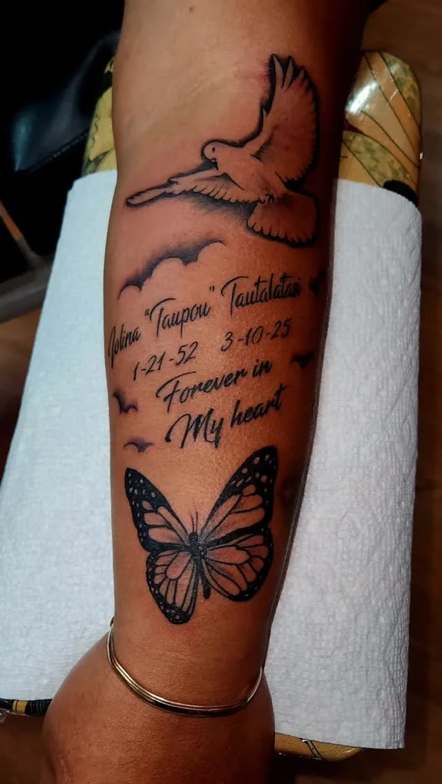 Tattoo of a dove flying above clouds, a butterfly below, and text with personal details and a quote.