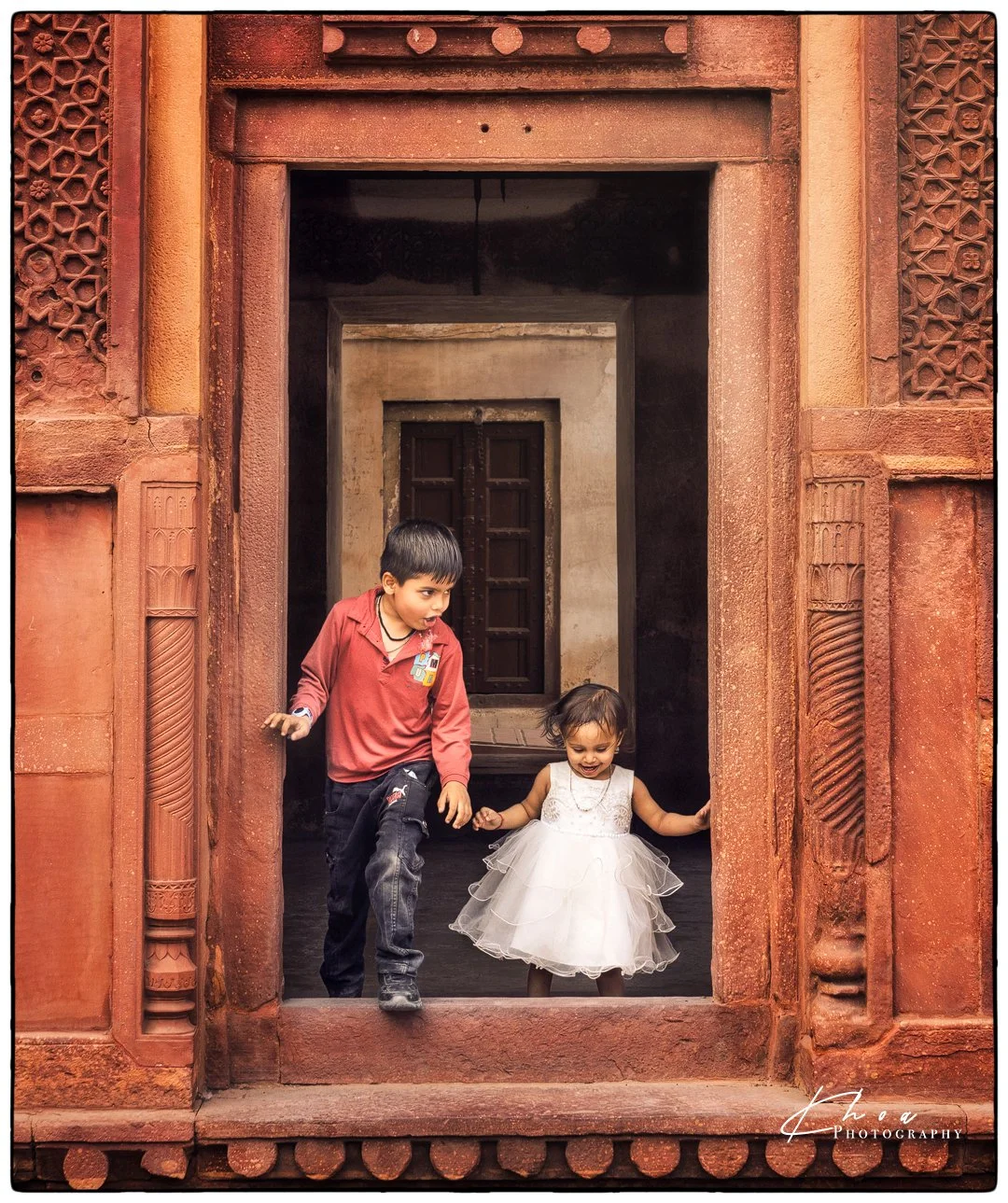 I'll take care of you, little sister. Agra Fort, India.