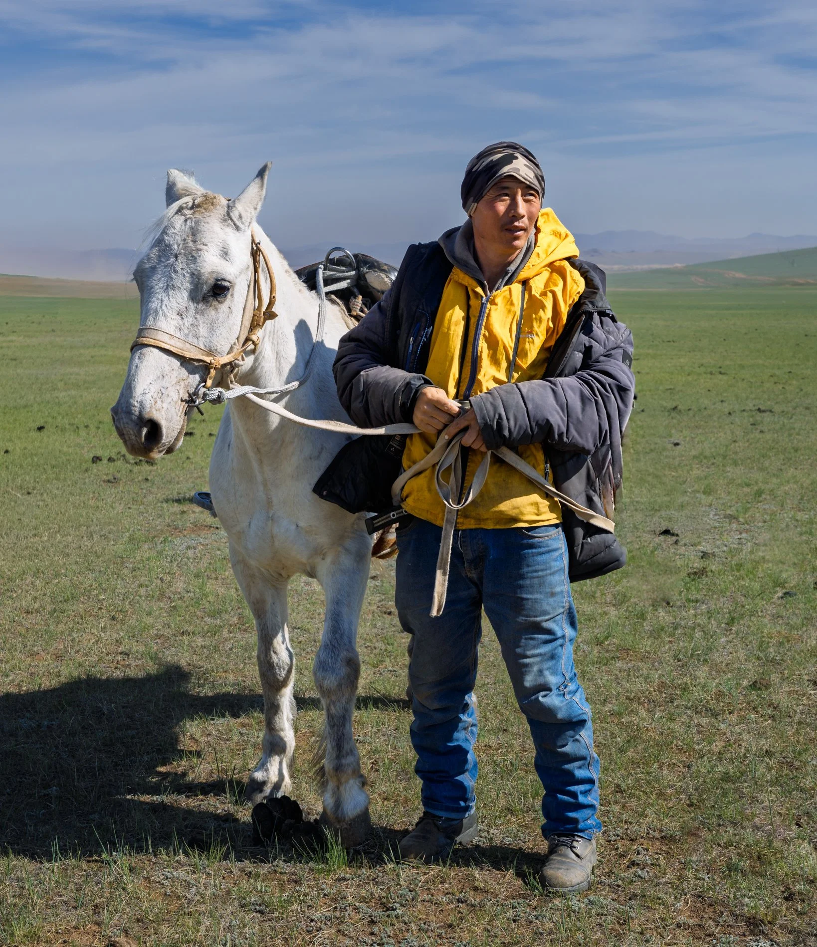 Mongolian Man with his horse