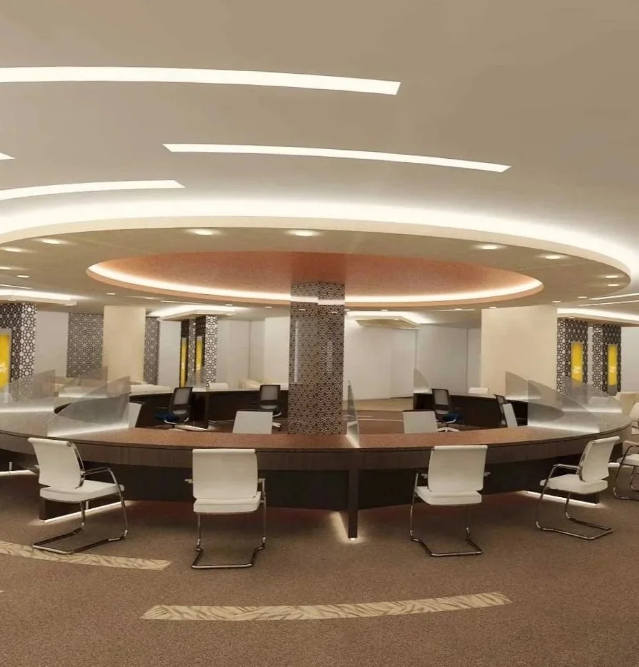Circular desk with chairs and circular false ceiling with warm lights and carpet on floor with the same design as the lights