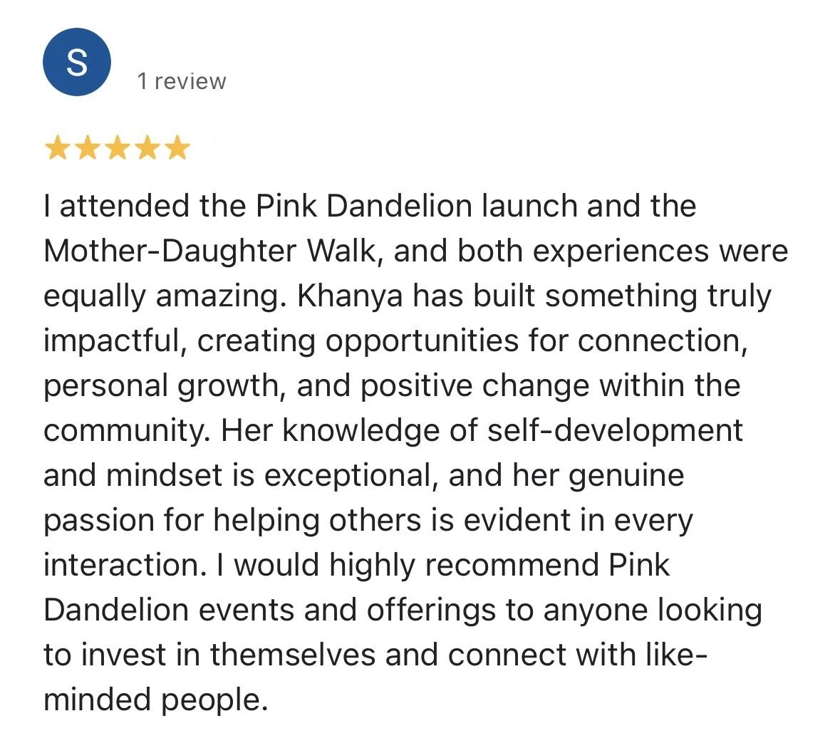 Screenshot of a Google review with five stars for Pink Dandelion, praising the events and the host, Khanya, for creating impactful experiences and fostering connection, growth, and positive change in the community.