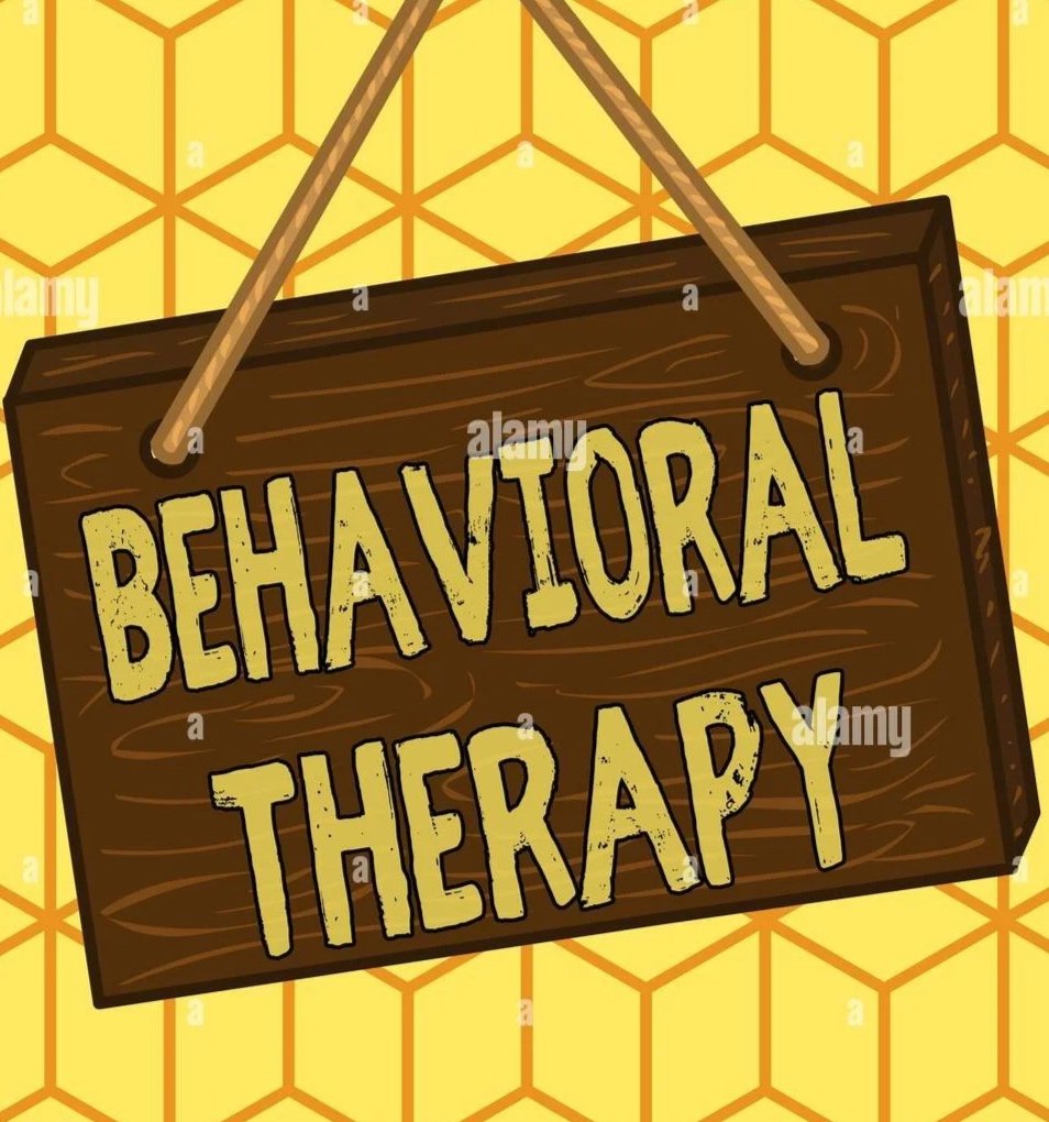 A wooden sign hanging with the words "Behavioral Therapy" written on it, against a yellow honeycomb pattern background.